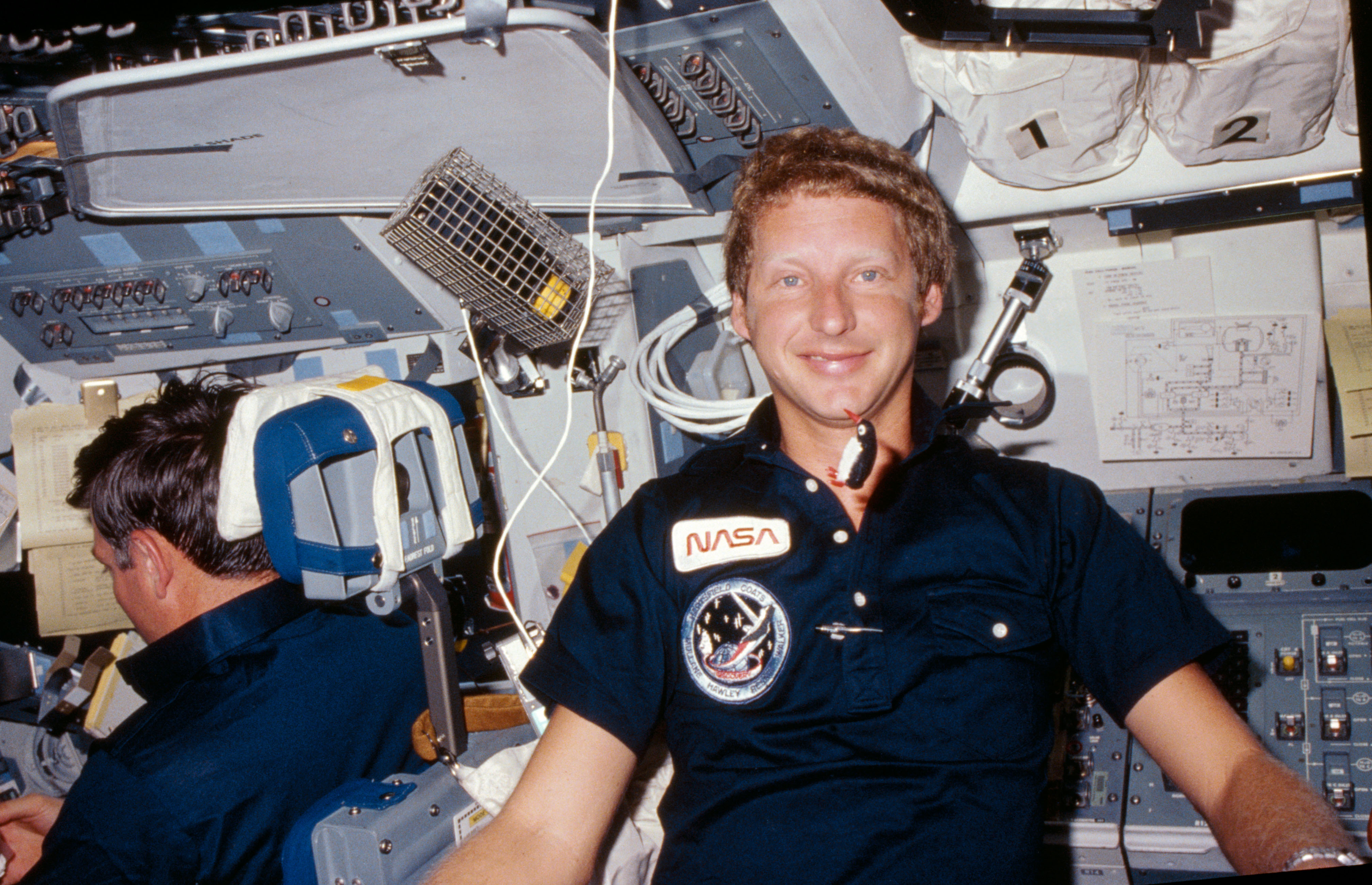 View of Mission specialist Steven Hawley on the flight deck