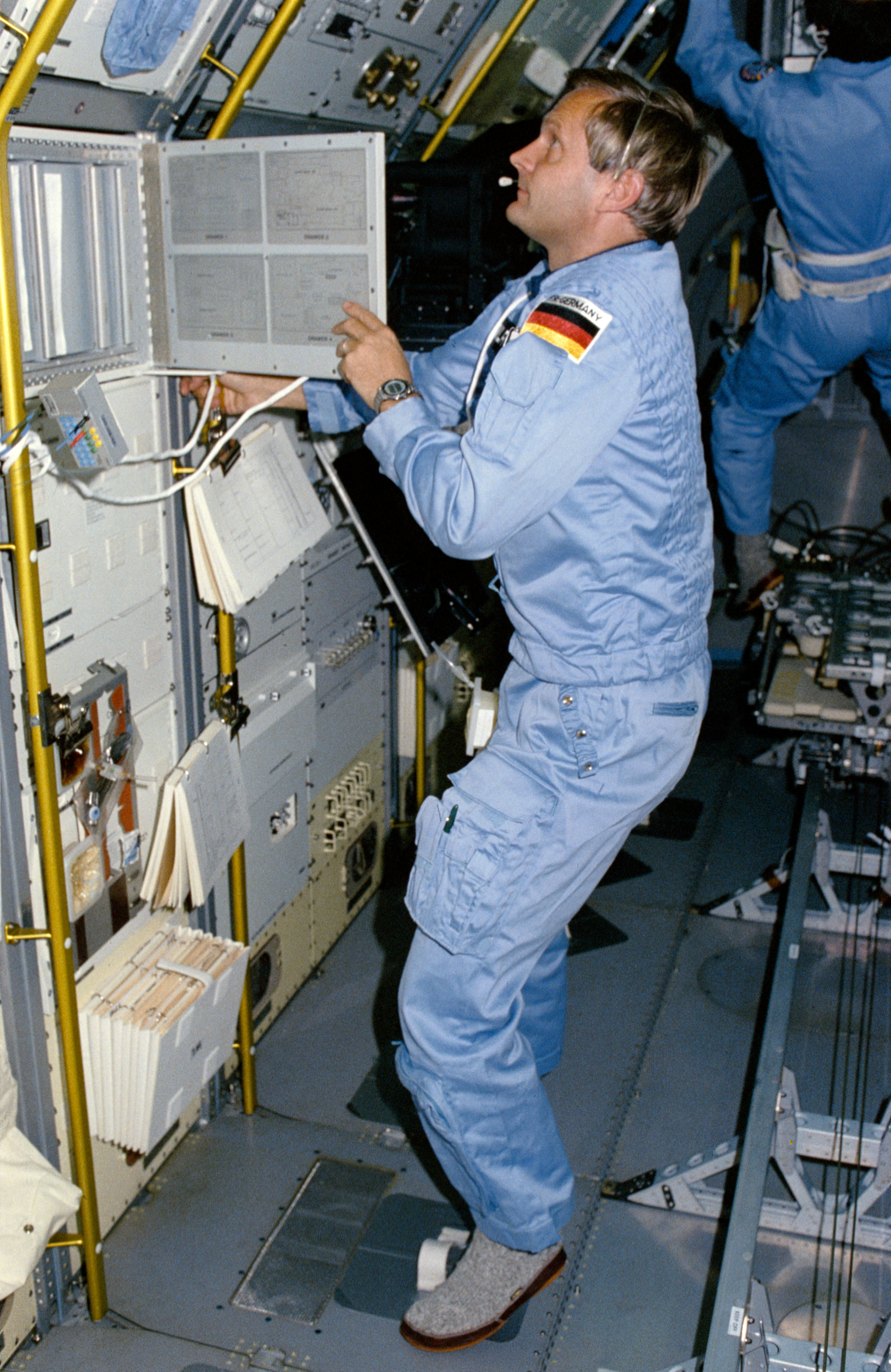 STS 61-A crewmembers in Spacelab D-1 science module