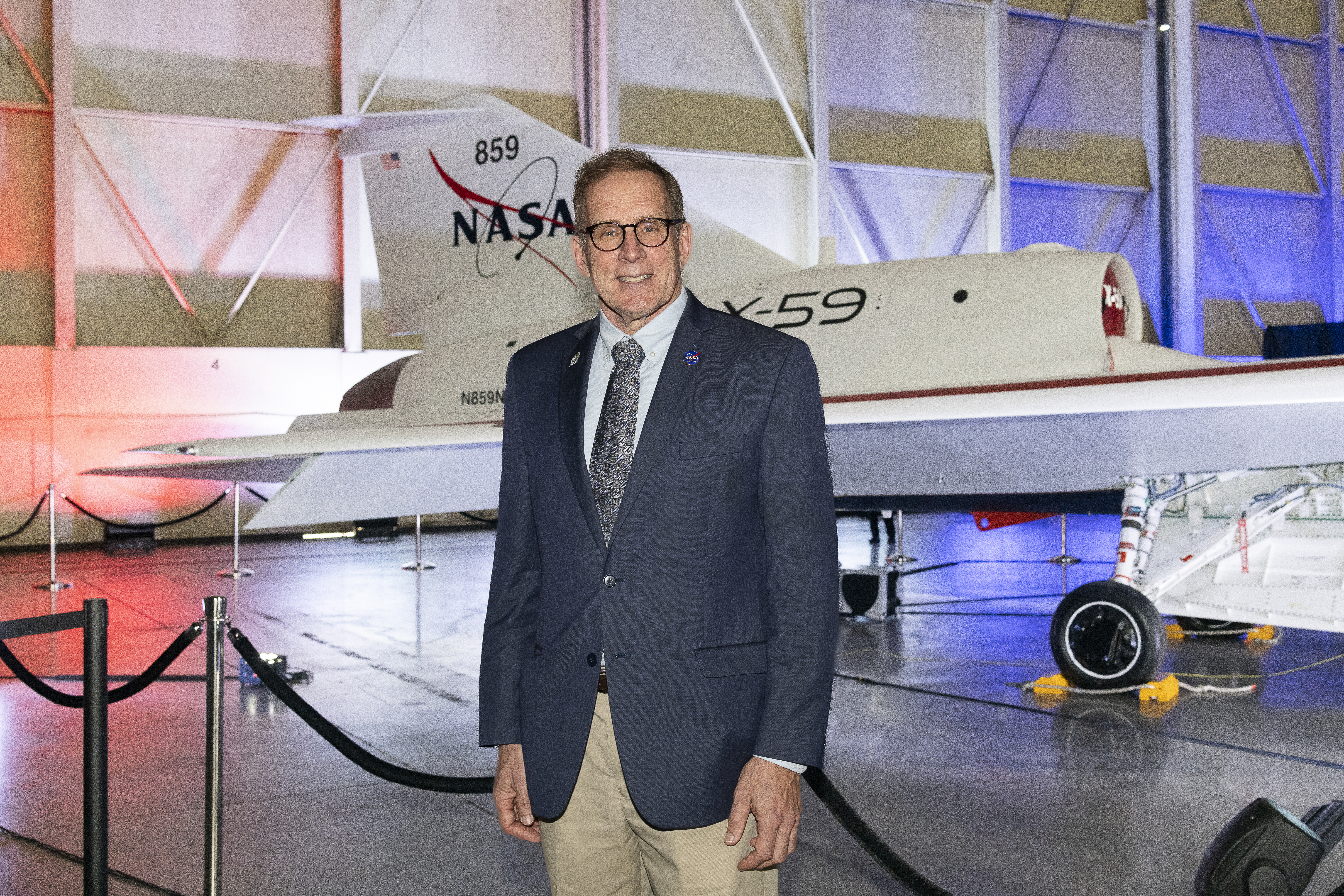 Mission Manager Peter Coen Poses in Front of Unveiled X-59