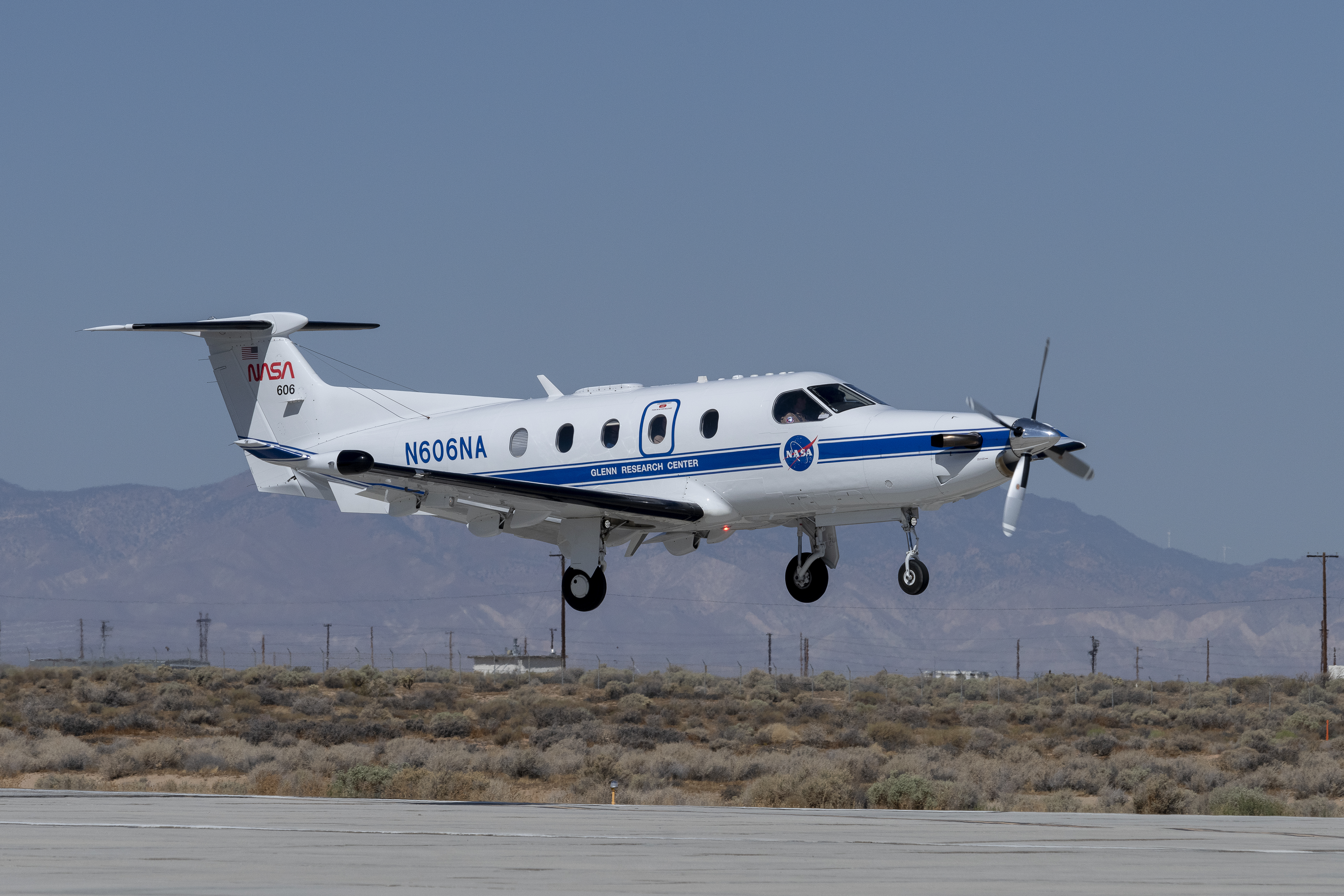 NASA Pilatus PC-12 performs touch-and-go maneuvers over the runway at NASA’s Armstrong Flight Research Center in Edwards, California to gather data on low-altitude Automatic Dependent Surveillance-Broadcast signals on Sept. 23, 2024.