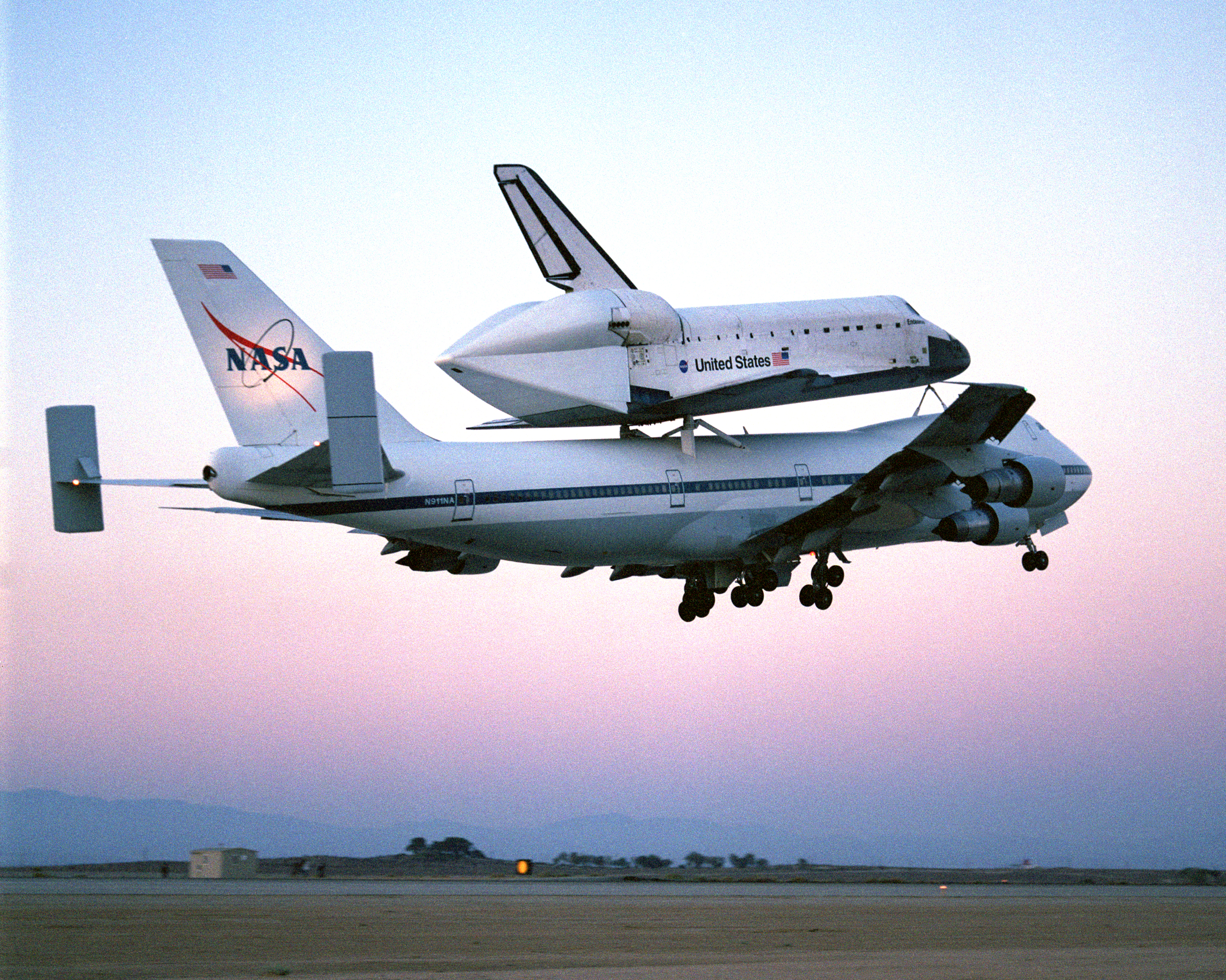 The Space Shuttle Endeavour, mounted securely atop one of NASA's modified Boeing 747 Shuttle Carrier Aircraft, left NASA's Dryden Flight Research Center at Edwards Air Force Base in Southern California at sunrise on Friday, June 28, nine days after conclu
