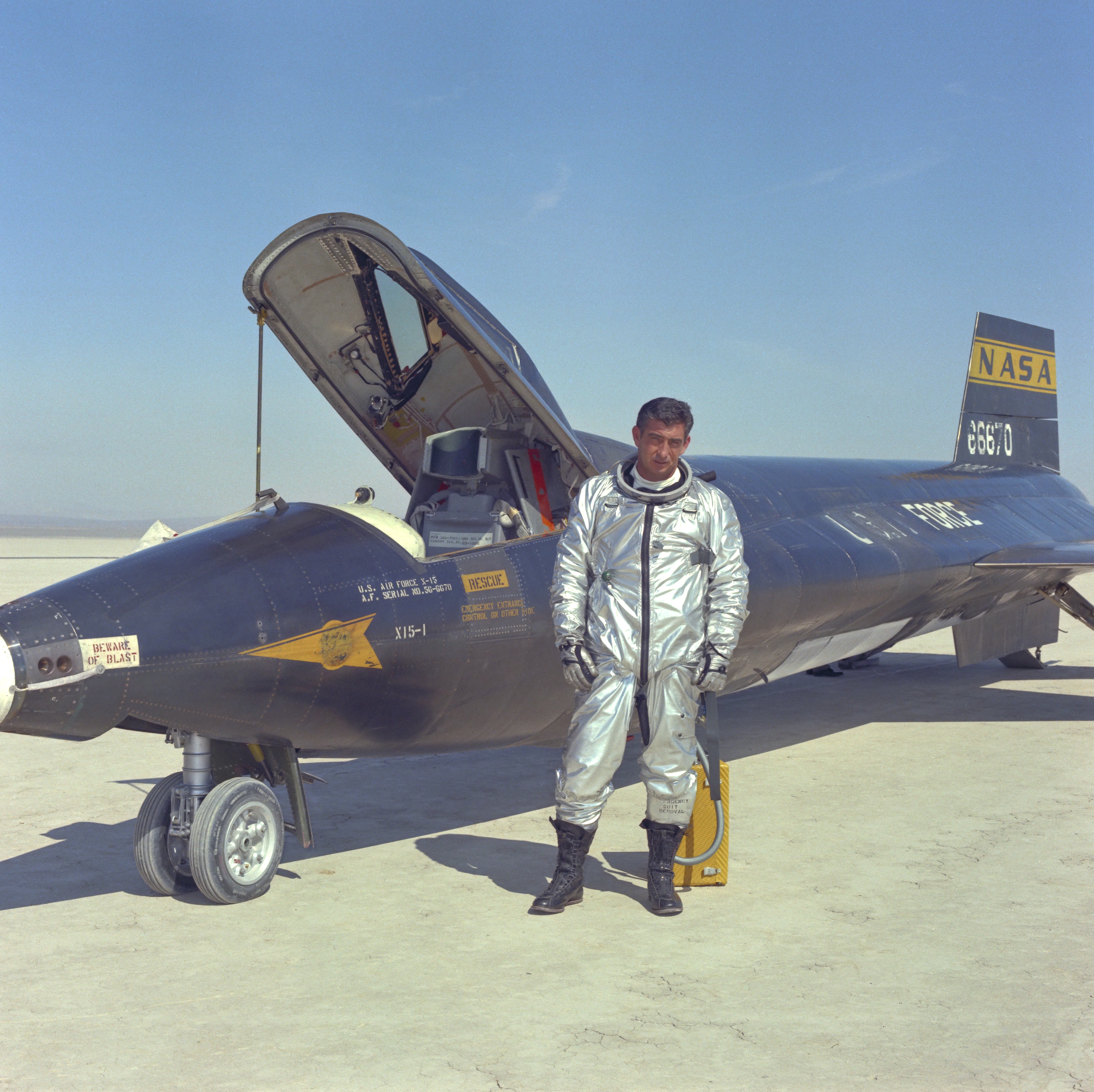 Air Force pilot Mike Adam poses with X-15 flown with NASA
