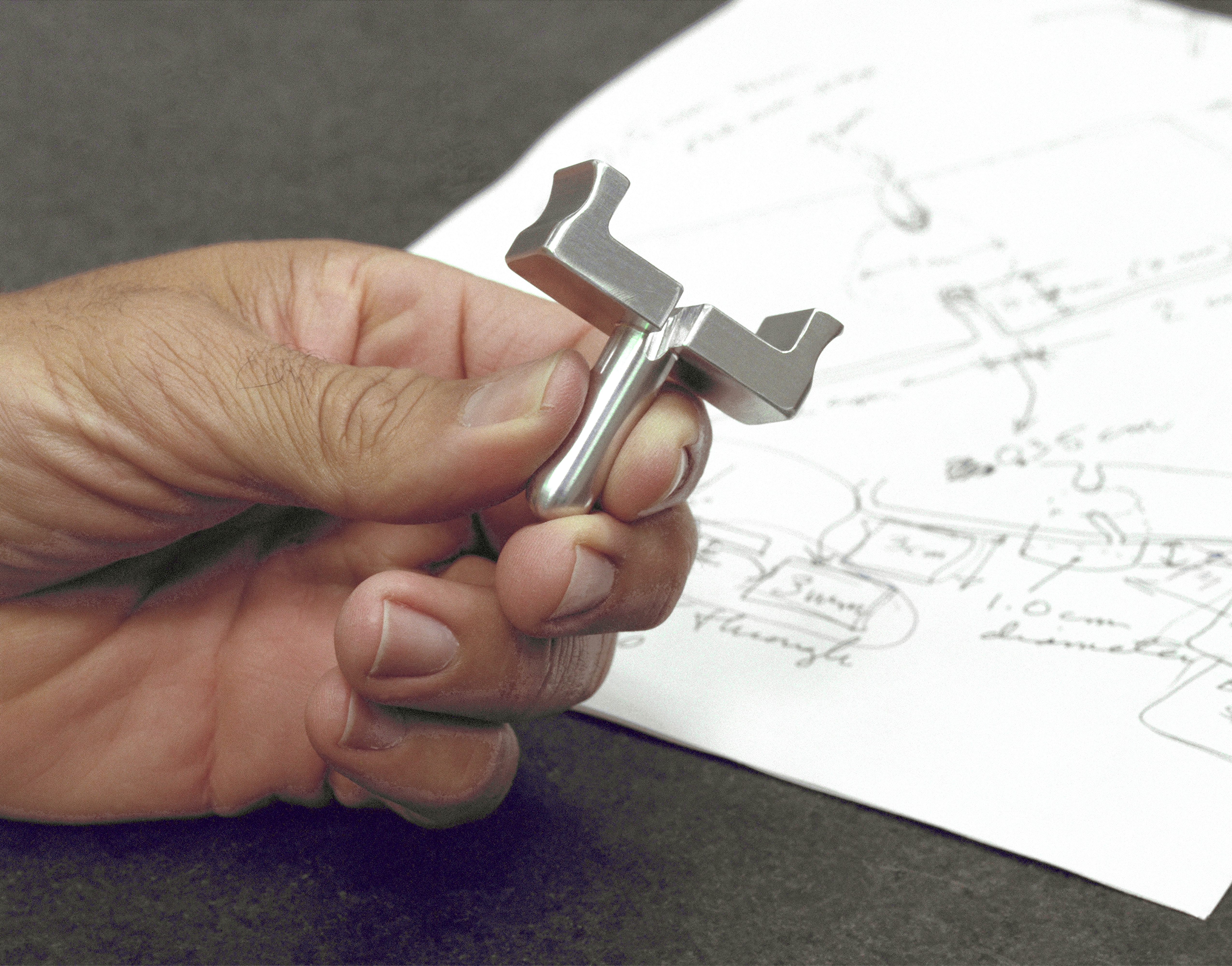Dryden-built surgical suture instrument