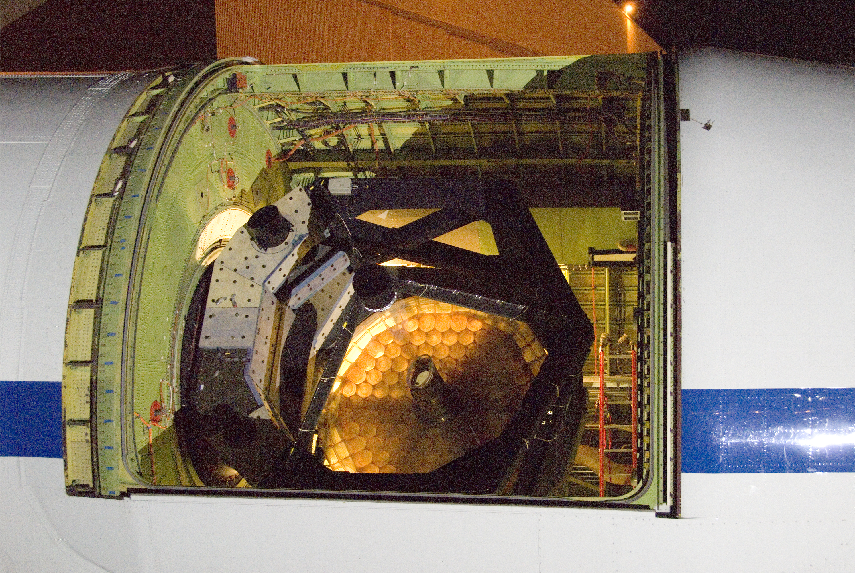 This backlit photo of SOFIA's infrared telescope during characterization testing shows the cell-like construction of the telescope's 2.5-meter primary mirror