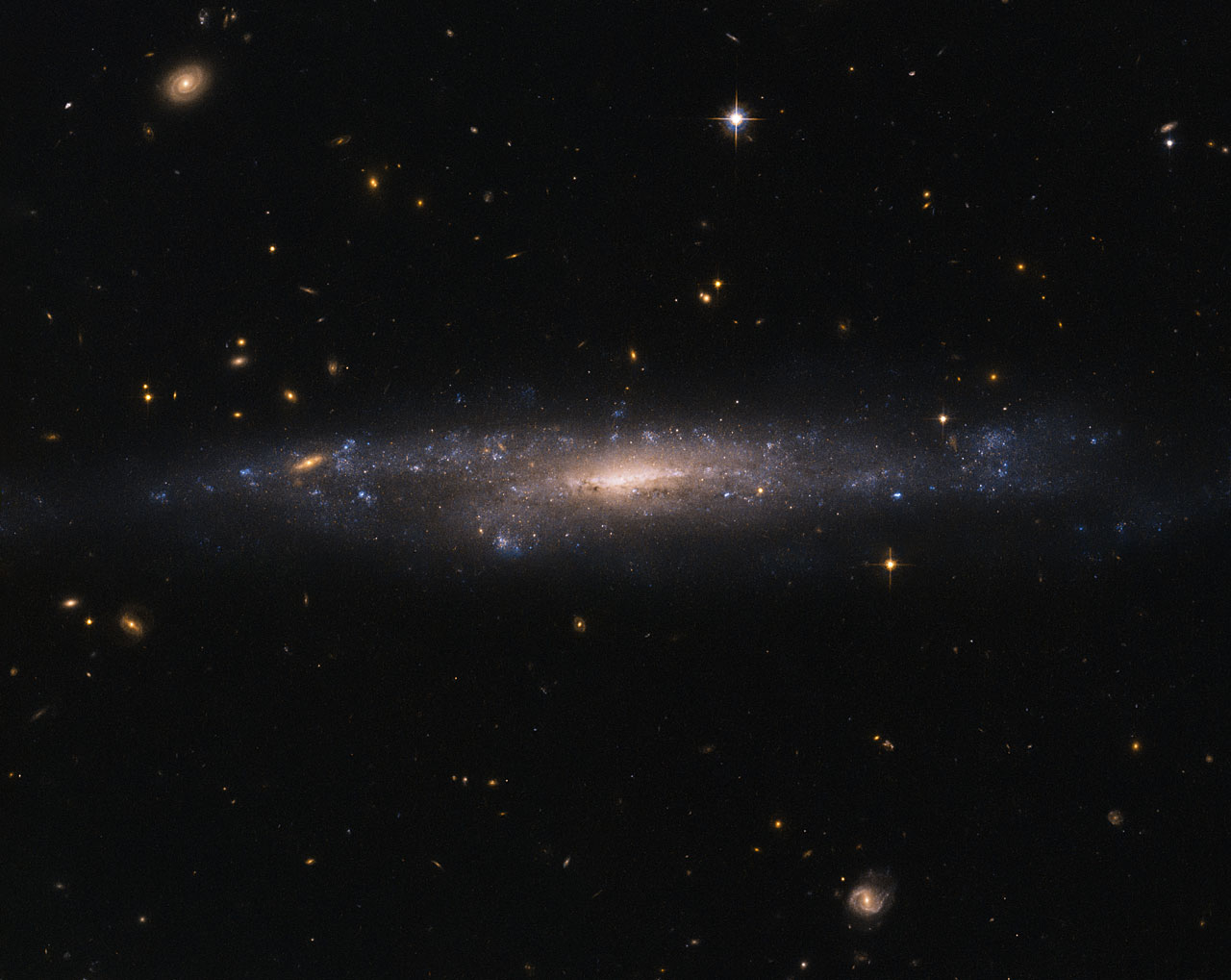 Hubble Sees Galaxy Hiding in the Night Sky