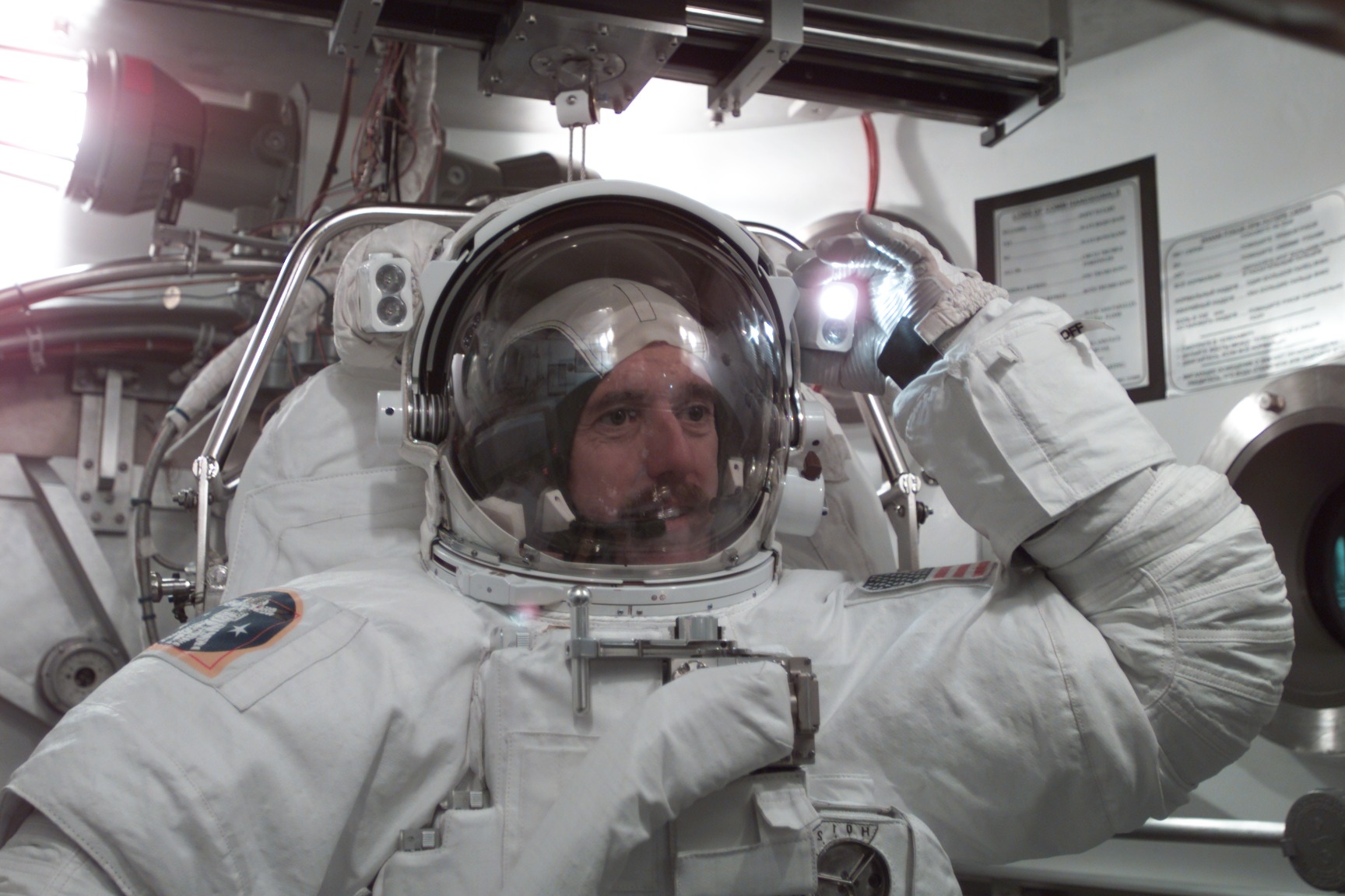 STS-104 Crew Training of Jim Reilly in EMU fit check