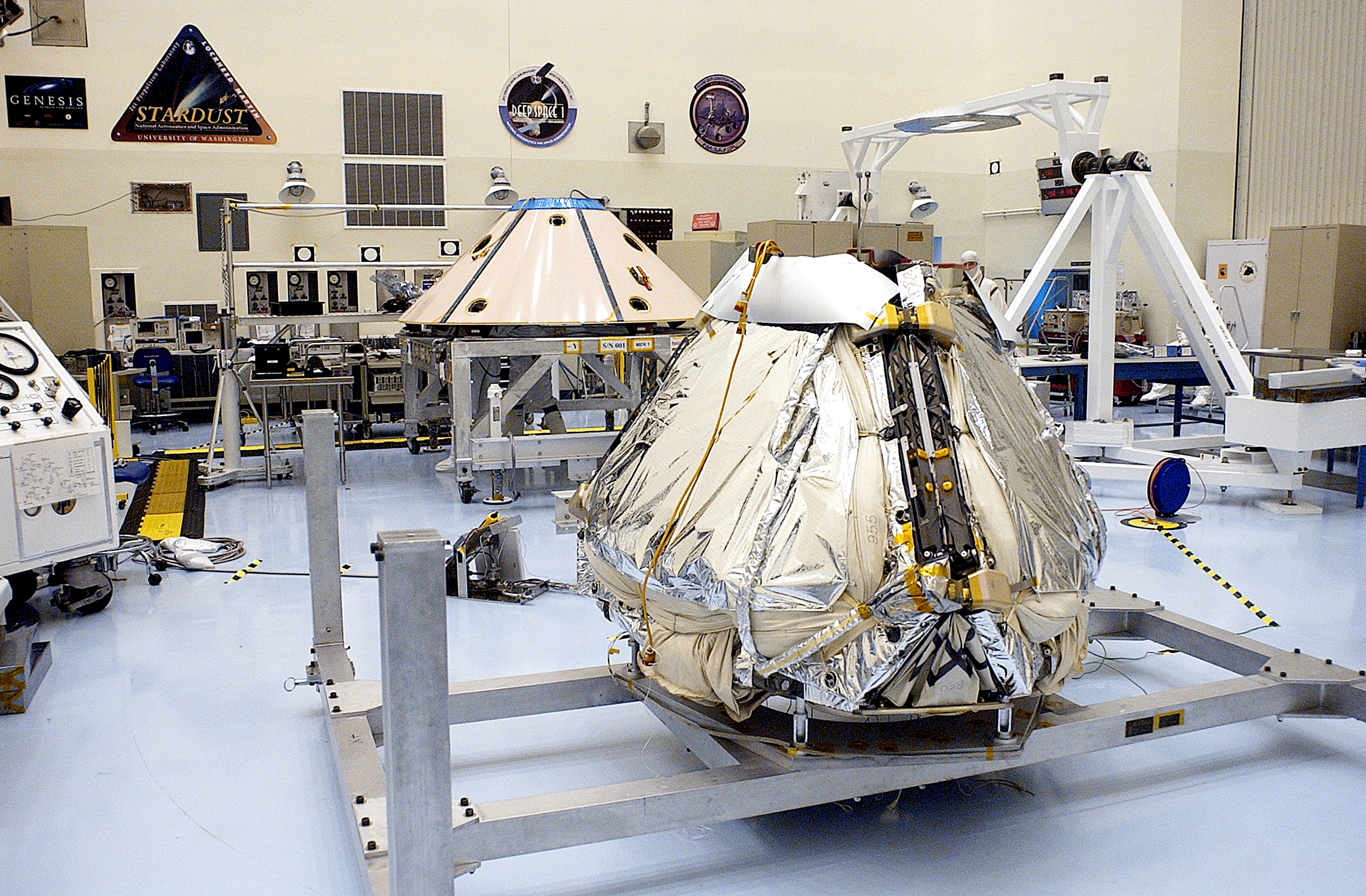 KENNEDY SPACE CENTER, FLA. - The Mars Exploration Rover 1 (MER-1) is seen after installation of the air bags on the outside of the lander. The airbags will inflate to cushion the landing of the spacecraft on the surface of Mars. When it stops bouncing and rolling, the airbags will deflate and retract, the petals will open to bring the lander to an upright position, and the rover will be exposed. NASA's twin Mars Exploration Rovers are designed to study the history of water on Mars. These robotic geologists are equipped with a robotic arm, a drilling tool, three spectrometers, and four pairs of cameras that allow them to have a human-like, 3D view of the terrain. Each rover could travel as far as 100 meters in one day to act as Mars scientists' eyes and hands, exploring an environment where humans can't yet go. MER-1 is scheduled to launch June 25 as MER-B aboard a Delta II rocket from Cape Canaveral Air Force Station.