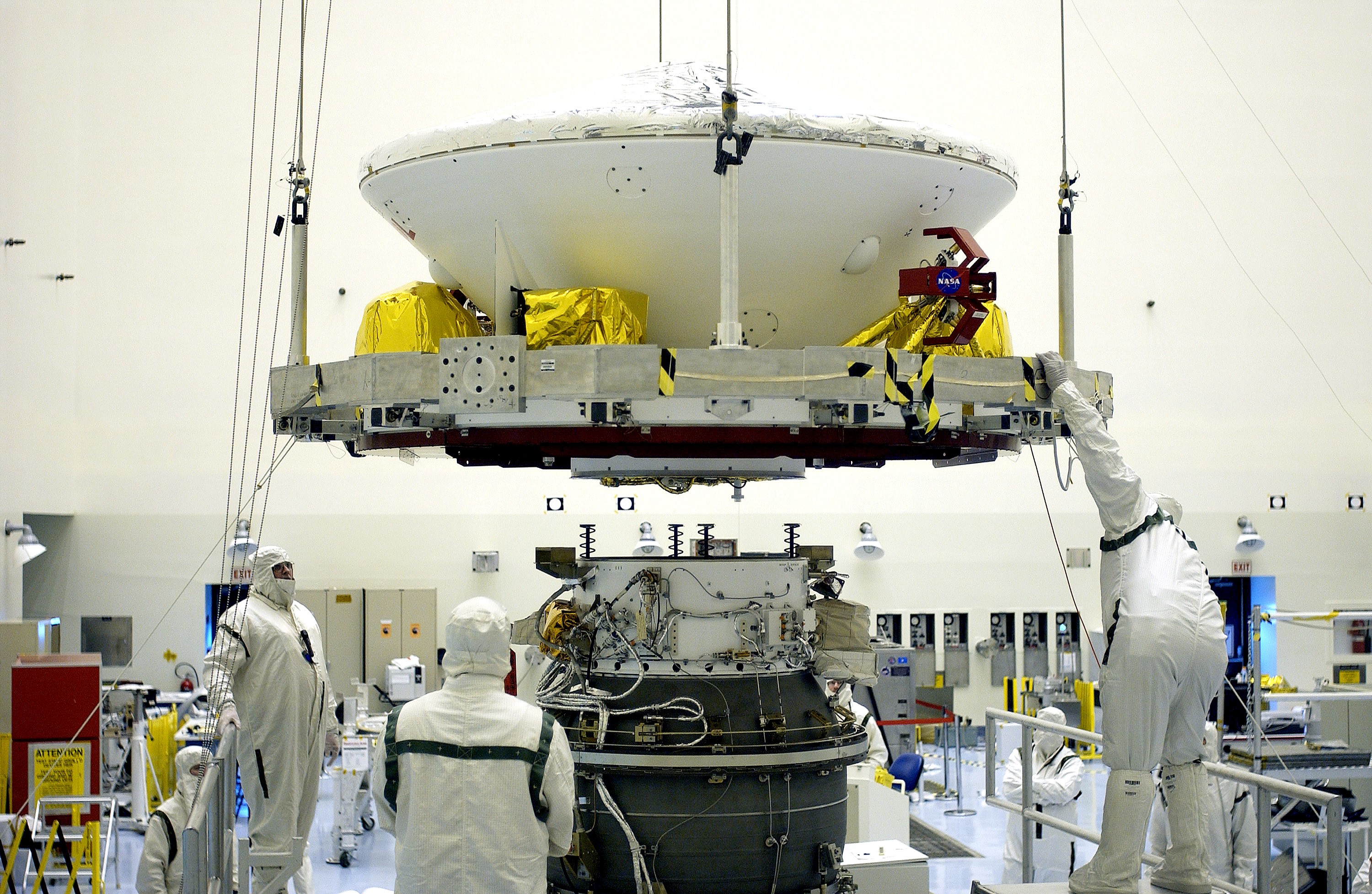 KENNEDY SPACE CENTER, FLA. - In the Payload Hazardous Servicing Facility, workers prepare to mate the Mars Exploration Rover-2 (MER-2) to the third stage of a Delta II rocket for launch on June 5. NASA’s twin Mars Exploration Rovers are designed to study the history of water on Mars. These robotic geologists are equipped with a robotic arm, a drilling tool, three spectrometers, and four pairs of cameras that allow them to have a human-like, 3D view of the terrain. Each rover could travel as far as 100 meters in one day to act as Mars scientists' eyes and hands, exploring an environment where humans can’t yet go. MER-1 (MER-B) will launch June 25.