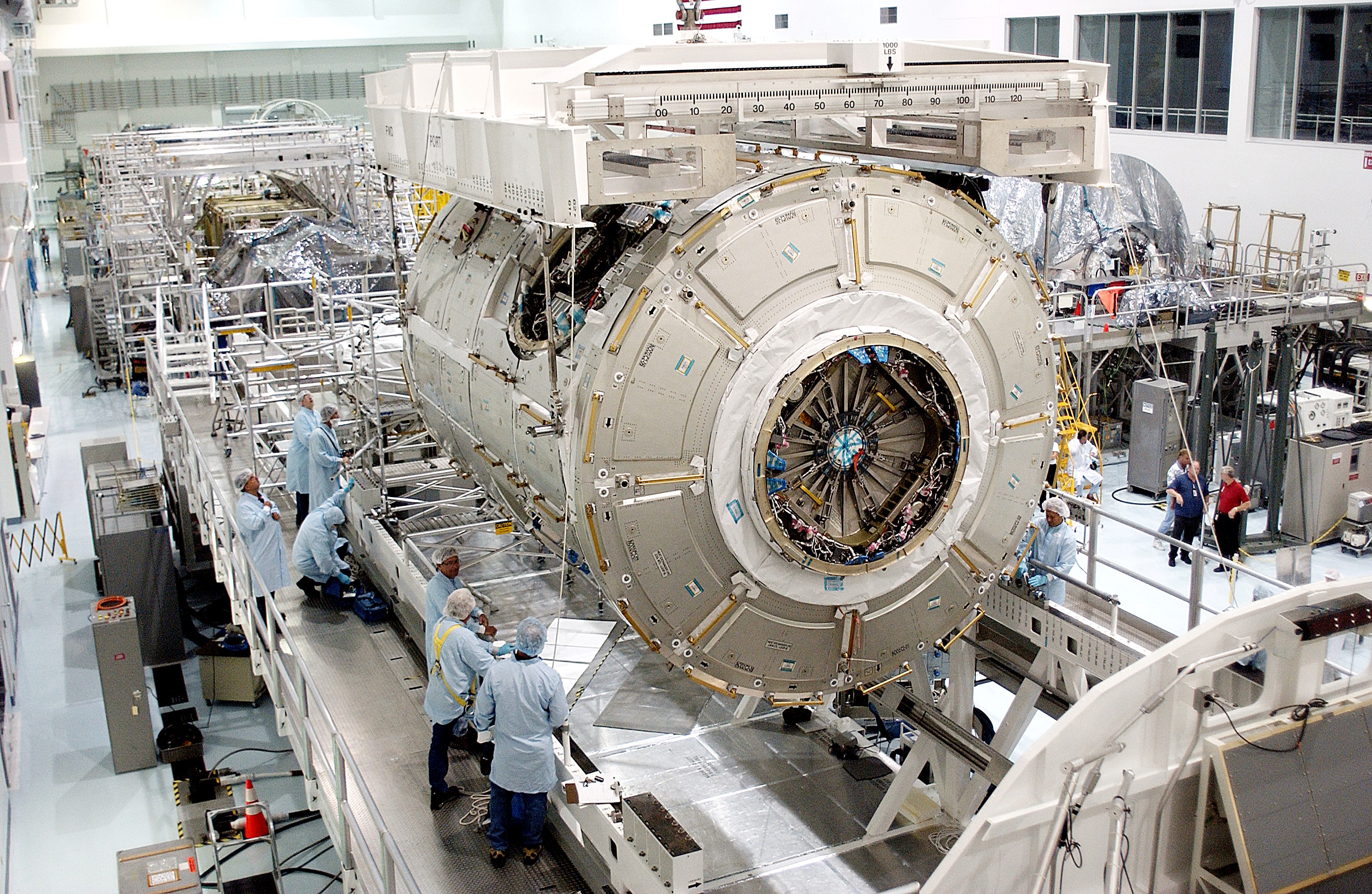 KENNEDY SPACE CENTER, FLA. - The U.S. Node 2 is lowered toward a workstand in the Space Station Processing Facility. The second of three connecting modules on the International Space Station, the Italian-built Node 2 attaches to the end of the U.S. Lab and provides attach locations for the Japanese laboratory, European laboratory, the Centrifuge Accommodation Module and, later, Multipurpose Logistics Modules. It will provide the primary docking location for the Shuttle when a pressurized mating adapter is attached to Node 2. Installation of the module will complete the U.S. Core of the ISS. Node 2 is the designated payload for mission STS-120. No orbiter or launch date has been determined yet.