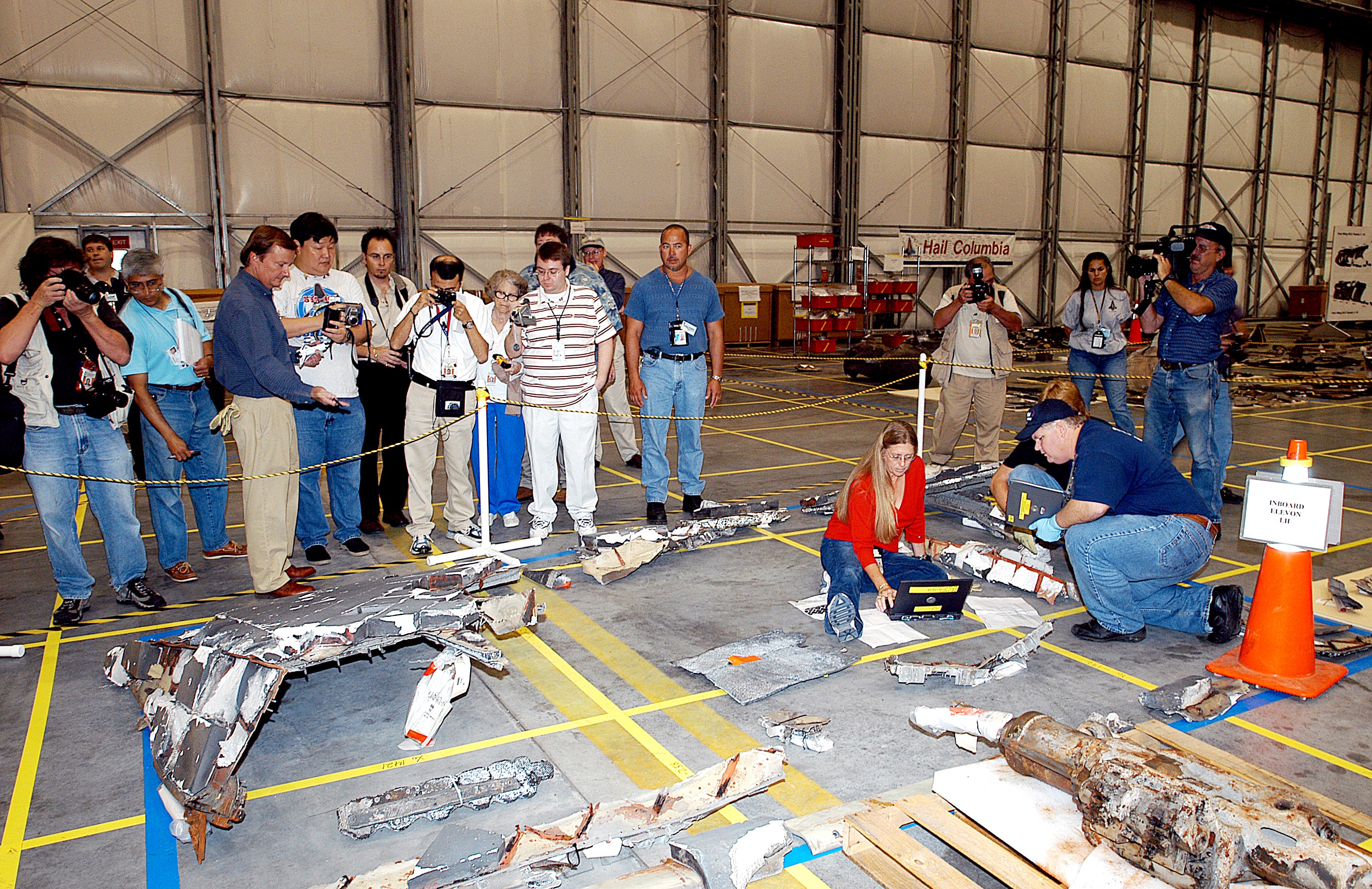 KENNEDY SPACE CENTER, FLA. - The media get a guided tour of the Columbia Debris Hangar. Shuttle Launch Director Mike Leinbach discussed activities that have taken place since the Columbia accident on Feb. 1, 2003. STS-107 debris recovery and reconstruction operations are winding down. To date, nearly 84,000 pieces of debris have been recovered and sent to KSC. That represents about 38 percent of the dry weight of Columbia, equaling almost 85,000 pounds.