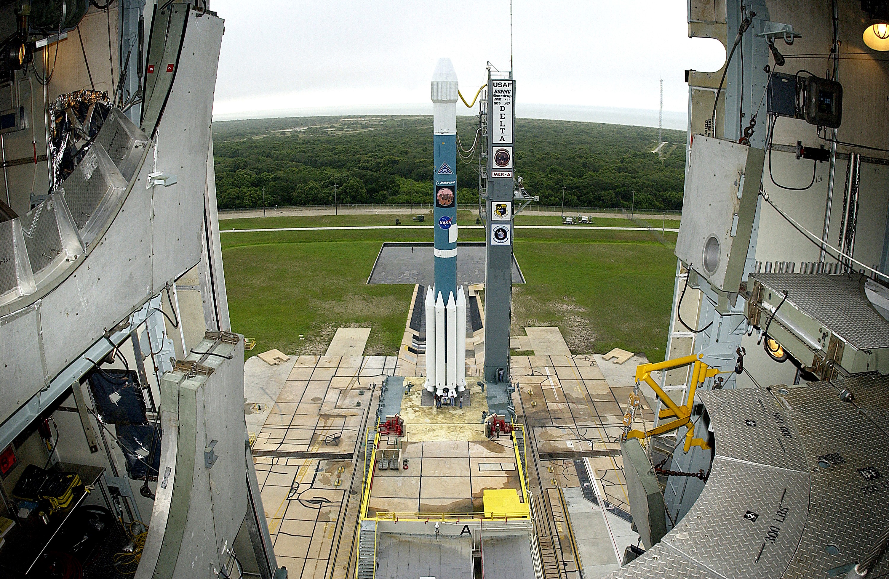 KENNEDY SPACE CENTER, FLA. - On Launch Complex 17-A, Cape Canaveral Air Force Station, the Boeing Delta II rocket and its Mars Exploration Rover (MER-A) payload are free of the tower and ready for launch. This will be the third launch attempt in as many days after weather concerns postponed the launches June 8 and June 9. MER-A is the first of two rovers being launched to Mars. When the two rovers arrive at Mars in 2004, they will bounce to airbag-cushioned landings at sites offering a balance of favorable conditions for safe landings and interesting science. The rovers see sharper images, can explore farther and examine rocks better than anything that has ever landed on Mars. The designated site for MER-A mission is Gusev Crater, which appears to have been a crater lake. The second rover, MER-B, is scheduled to launch June 25.