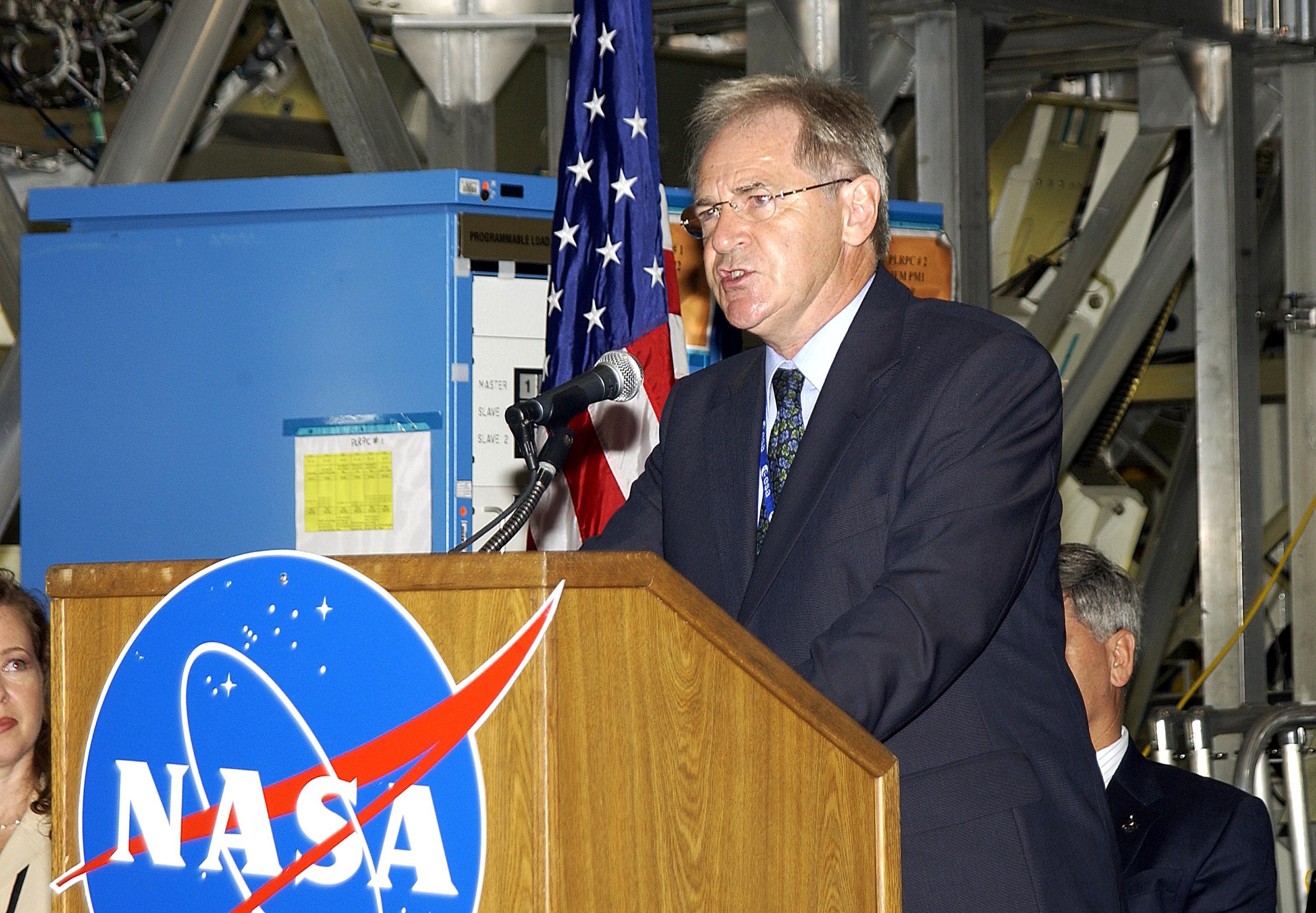 KENNEDY SPACE CENTER, FLA. - Alan Thirkettle, International Space Station Program manager for Node 2, European Space Agency (ESA), speaks to guests and the media gathered in the Space Station Processing Facility at a ceremony highlighting the arrival of two major components of the International Space Station. NASA's Node 2, built by the European Space Agency (ESA) in Italy, arrived at KSC on June 1. It will be the next pressurized module installed on the Station. The pressurized module of the Japanese Experiment Module (JEM), named "Kibo" (Hope), arrived at KSC on June 4. It is Japan's primary contribution to the Station. The ceremony held today included the official transfer of ownership signing of Node 2 between the ESA and NASA.. Emceed by Lisa Malone, deputy director of External Relations and Business Development at KSC, the ceremony also included these speakers: Center Director Roy Bridges Jr.; NASA’s Michael C. Kostelnik, deputy associate administrator for International Space Station and Shuttle Programs and William Gerstenmaier, International Space Station Program manager; Andrea Lorenzoni, International Space Station Program manager for Node 2, Italian Space Agency; and Kuniaki Shiraki, JEM Project manager, National Aerospace and Development Agency of Japan.