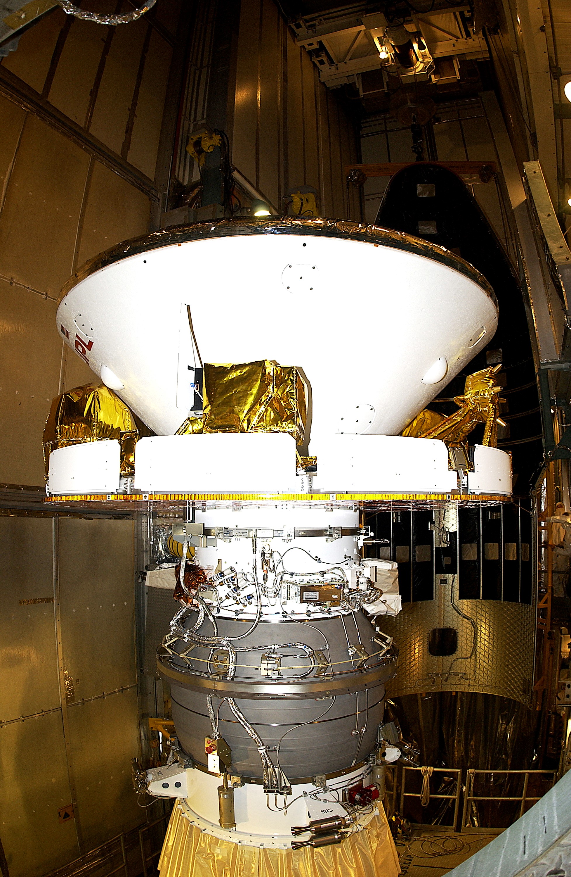 KENNEDY SPACE CENTER, FLA. - At Launch Complex 17-B, Cape Canaveral Air Force Station, Mars Exploration Rover-1 (MER-B) is prepared for the installation of its spacecraft fairing. The second of twin rovers being sent to Mars, it is equipped with a robotic arm, a drilling tool, three spectrometers, and four pairs of cameras that allow it to have a human-like, 3D view of the terrain. Each rover could travel as far as 100 meters in one day to act as Mars scientists' eyes and hands, exploring an environment where humans are not yet able to go. MER-B is scheduled to launch no earlier than June 28 at one of two available times, 11:56:16 p.m. EDT or 12:37:59 a.m. EDT.