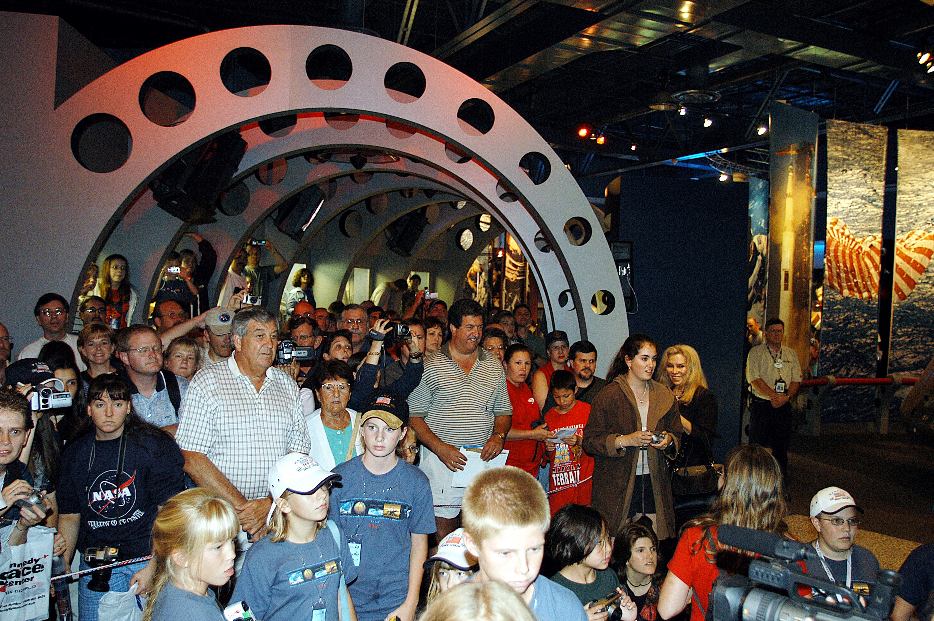 KENNEDY SPACE CENTER, FLA. - Hundreds of guests attend a ribbon cutting ceremony officially opening the U.S. Astronaut Hall of Fame as part of the Kennedy Space Center Visitor Complex. The ceremony was held in conjunction with the induction of four Space Shuttle astronauts into the Hall of Fame including Daniel Brandenstein, Robert "Hoot" Gibson, Story Musgrave, and Sally Ride. Conceived by six of the Mercury Program astronauts, the U.S. Astronaut Hall of Fame opened in 1990 to provide a place where space travelers could be remembered for their participation and accomplishments in the U.S. space program. The four new inductees join 48 previously honored astronauts from the ranks of the Gemini, Apollo, Skylab, Apollo-Soyuz, and Space Shuttle programs.