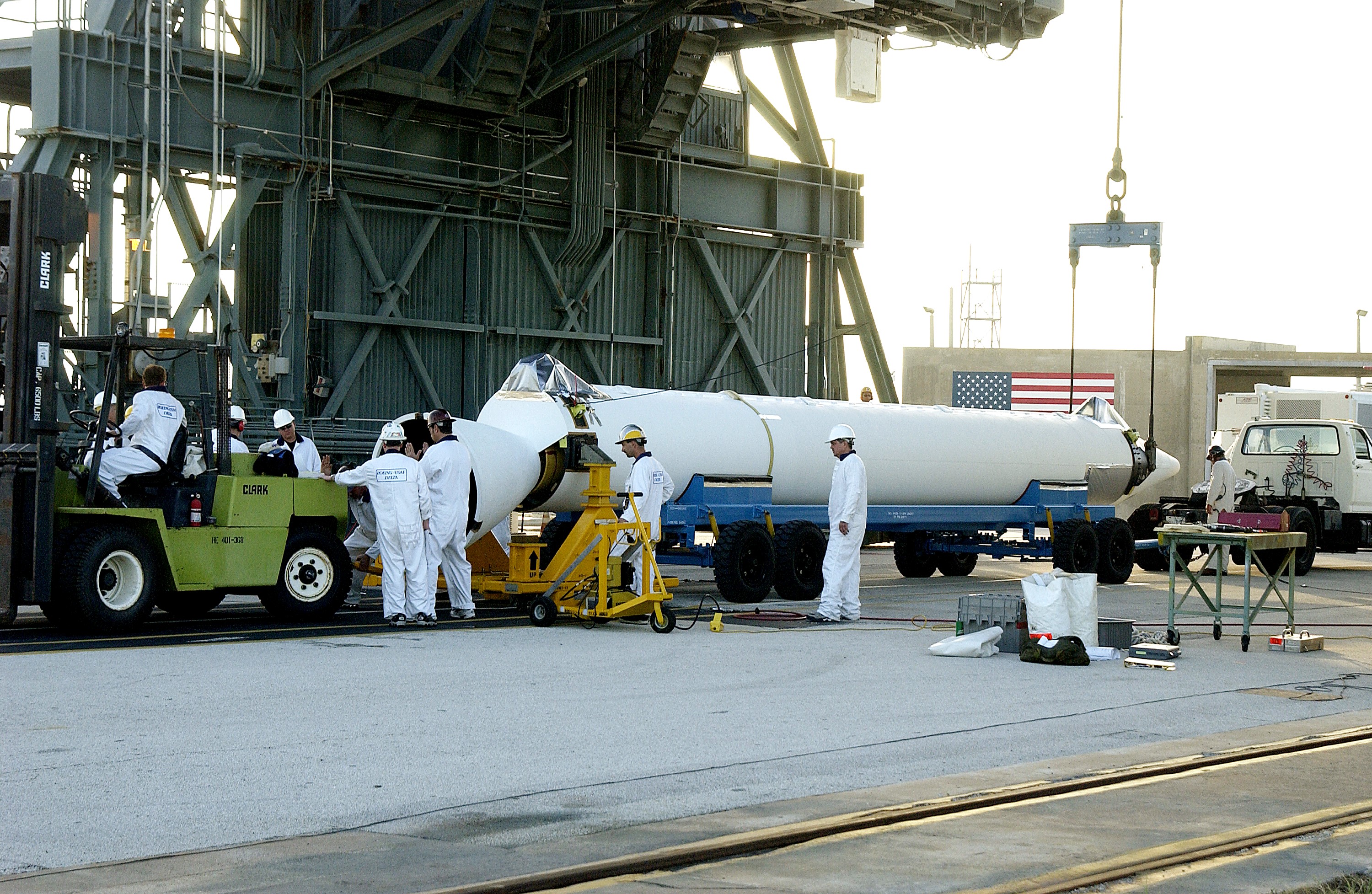 KENNEDY SPACE CENTER, FLA. - A solid rocket booster (SRB) for the Delta II Heavy rocket that will launch the Space Infrared Telescope Facility (SIRTF) arrives at Launch Complex 17-B, Cape Canaveral Air Force Station. The Delta II Heavy features nine 46-inch-diameter, stretched SRBs. Consisting of three cryogenically cooled science instruments and an 0.85-meter telescope, SIRTF is one of NASA's largest infrared telescopes to be launched. SIRTF will obtain images and spectra by detecting the infrared energy, or heat, radiated by objects in space. Most of this infrared radiation is blocked by the Earth's atmosphere and cannot be observed from the ground.