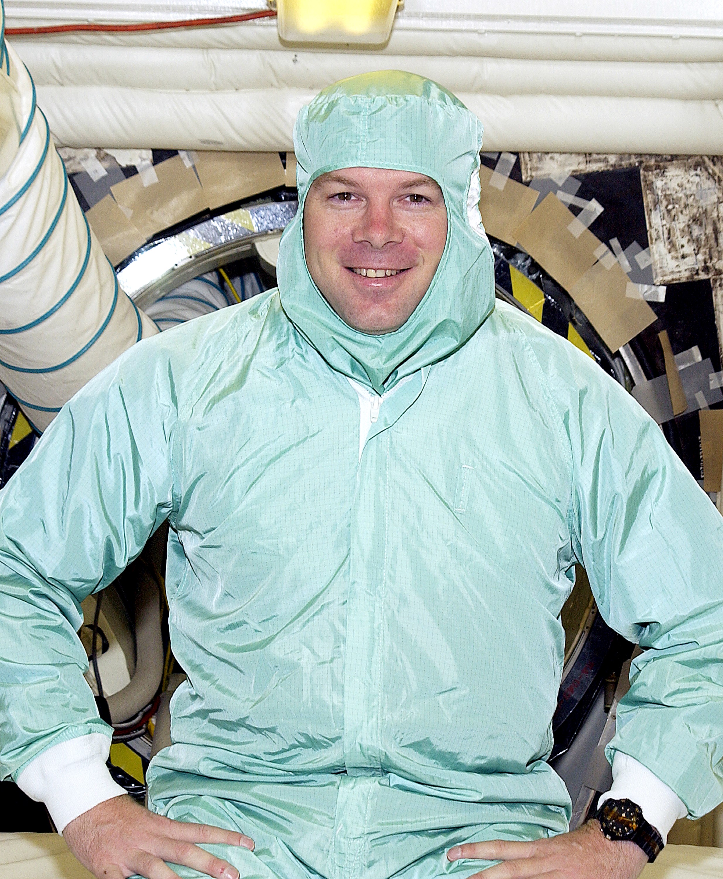 KENNEDY SPACE CENTER, FLA. - STS-114 Pilot James Kelly sits in the entry hatch to orbiter Atlantis. He and other crew members - Commander Eileen Collins and Mission Specialists Soichi Noguchi and Stephen Robinson - are at KSC for equipment familiarization. Noguchi is with the Japanese space agency NASDA. Mission STS-114 will carry the MultiPurpose Logistics Module (MPLM) Raffaello and External Stowage Platform 2 to the International Space Station. The MPLM will contain supplies and equipment. Another goal of the mission is to remove and replace a Control Moment Gyro. Launch date for mission STS-114 is under review.