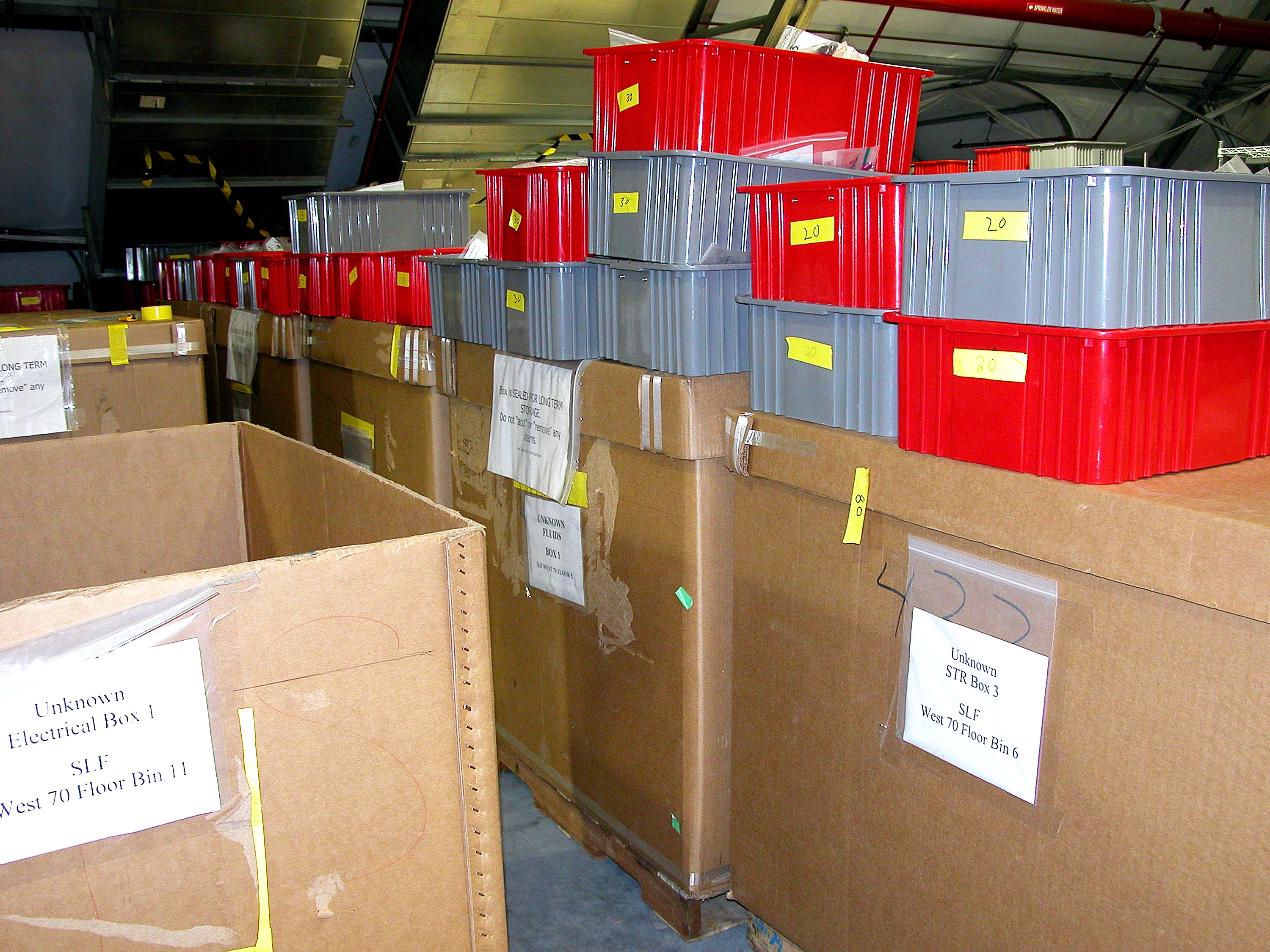 KENNEDY SPACE CENTER, FLA. - Storage boxes and other containers of Columbia debris wait in the Columbia Debris Hangar for transfer to storage in the Vehicle Assembly Building. About 83,000 pieces were shipped to KSC during search and recovery efforts in East Texas.