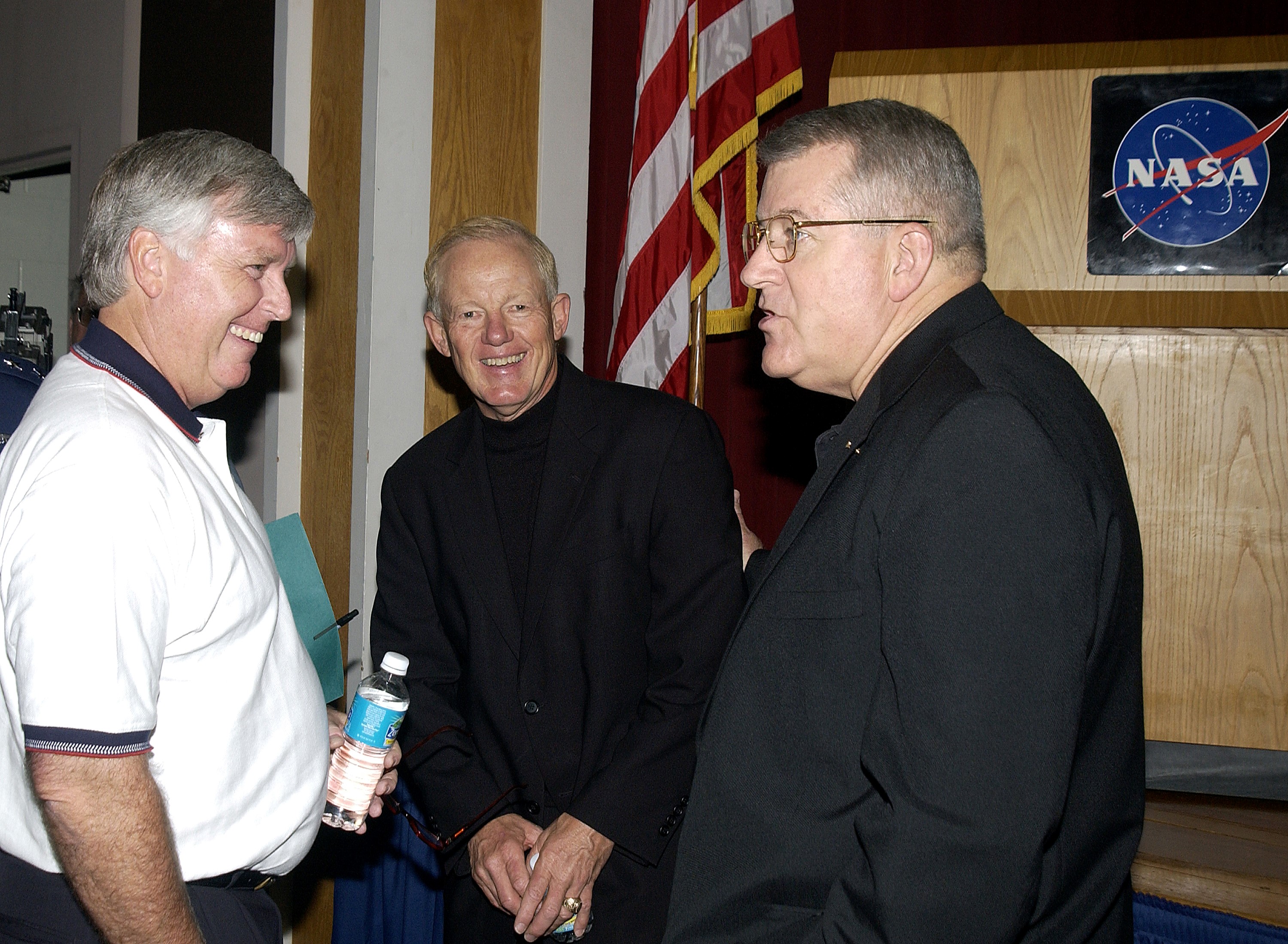 KENNEDY SPACE CENTER, FLA. - Before the start of the kickoff presentation for Spaceport Super Safety and Health Day, Center Director Jim Kennedy (left) chats with guest speaker Capt. Charles Plumb (USNR retired) and United Space Alliance Vice President and Deputy Program Manager, Florida Operations, Bill Pickavance. Spaceport Super Safety and Health Day is an annual event at KSC and Cape Canaveral Air Force Station dedicated to reinforcing safe and healthful behaviors in the workforce. Safety Awards were also given to individuals and groups.