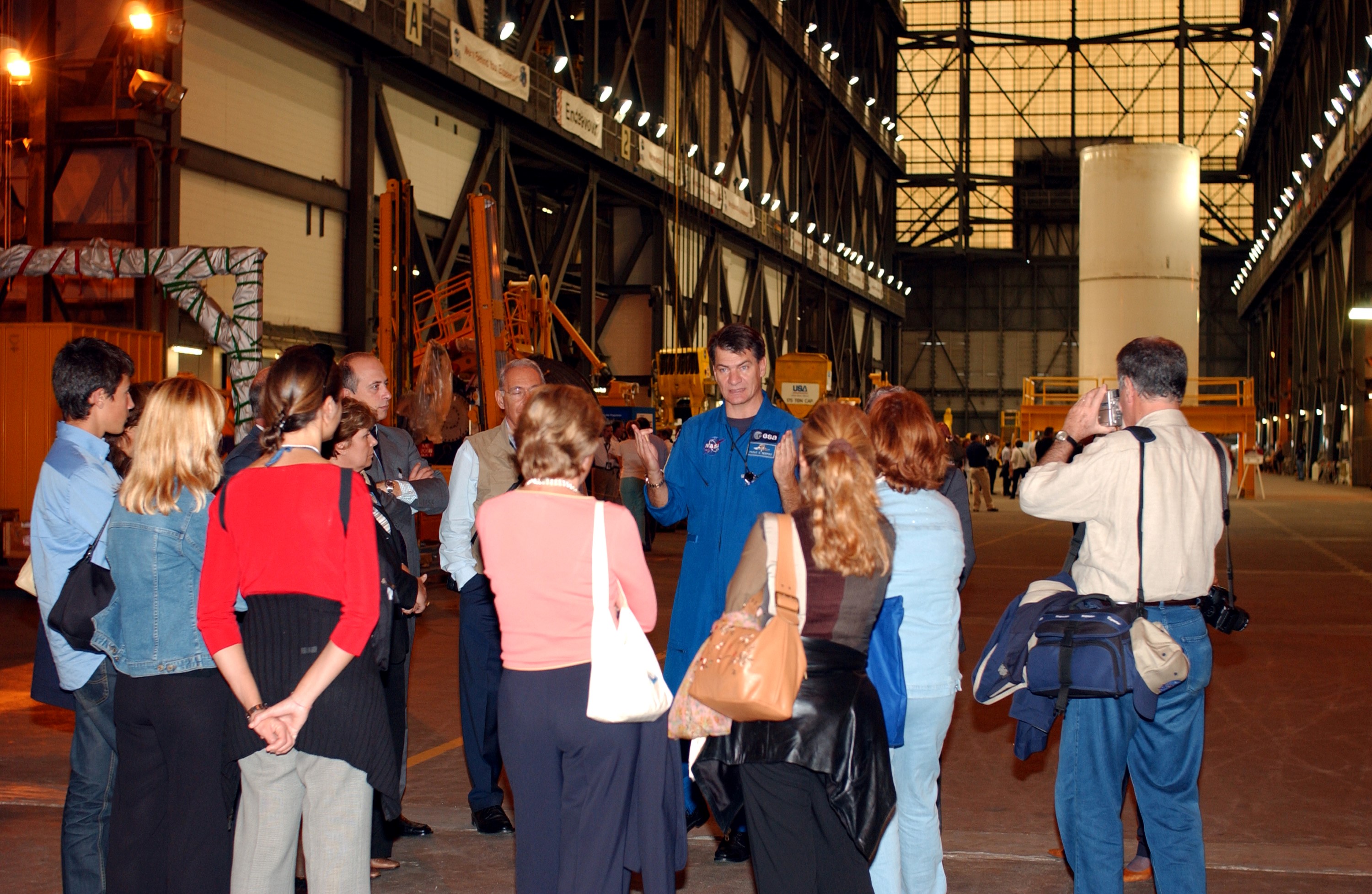 KENNEDY SPACE CENTER, FLA. - Members of the North American Treaty Organization (NATO) Parliamentary Assembly visit the Vehicle Assembly Building during their tour of KSC. They are listening to comments from Italian astronaut Paolo Angelo Nespoli, who is with the European Space Agency. The members are meeting in Orlando this year for their 49th annual gathering. They chose to visit KSC with their families during their one-day excursion break from meetings.