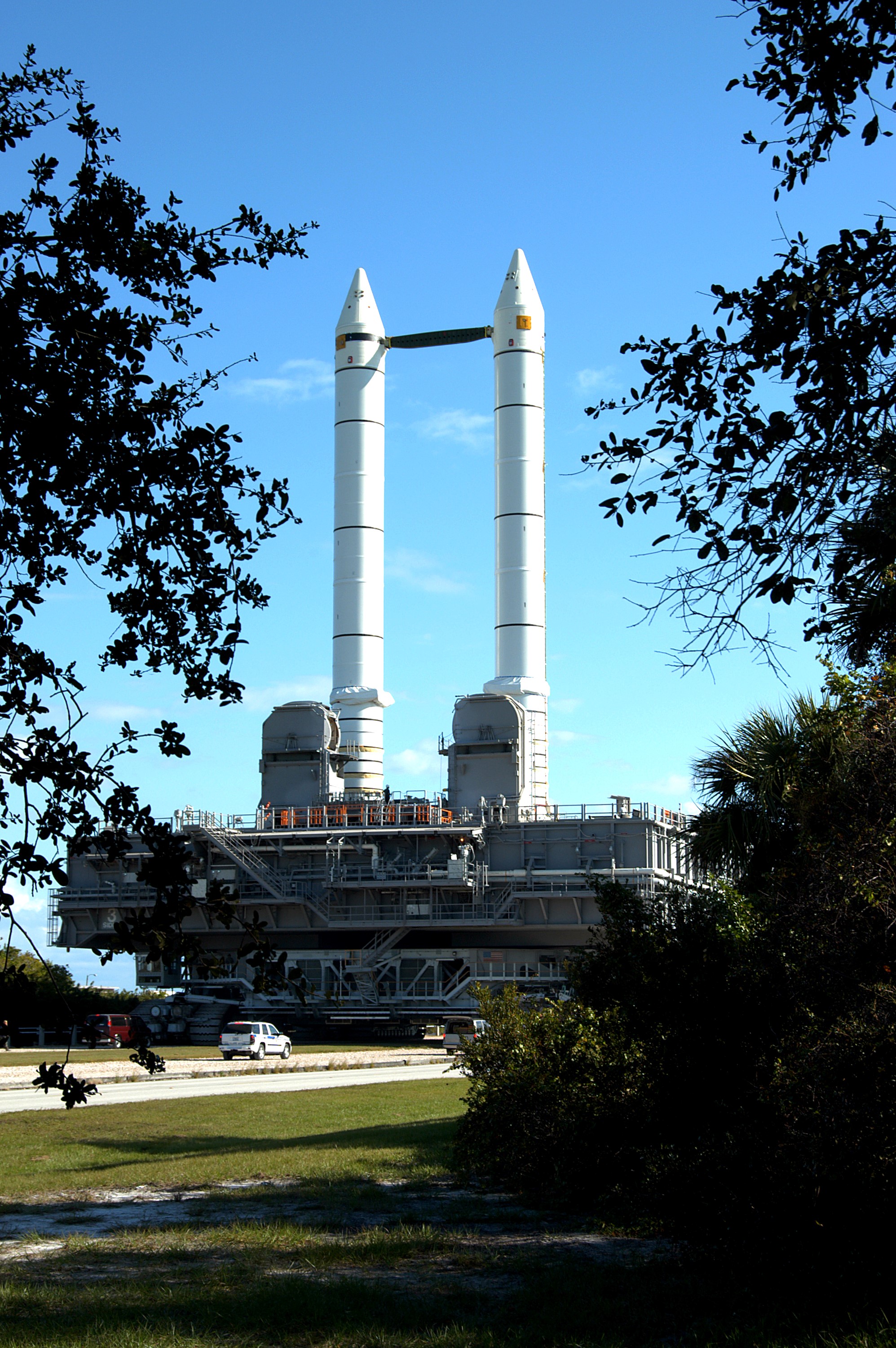 KENNEDY SPACE CENTER, FLA. - The crawler transporter slowly moves the Mobile Launcher Platform (MLP), carrying a set of twin solid rocket boosters, along the crawlerway in support of engineering analysis vibration tests on the crawler and MLP. The crawler is moving at various speeds up to 1 mph in an effort to achieve vibration data gathering goals as it leaves the VAB and then returns. The boosters are braced at the top for stability. The primary purpose of these rollout tests is to gather data to develop future maintenance requirements on the transport equipment and the flight hardware. Various parts of the MLP and crawler transporter have been instrumented with vibration data collection equipment.