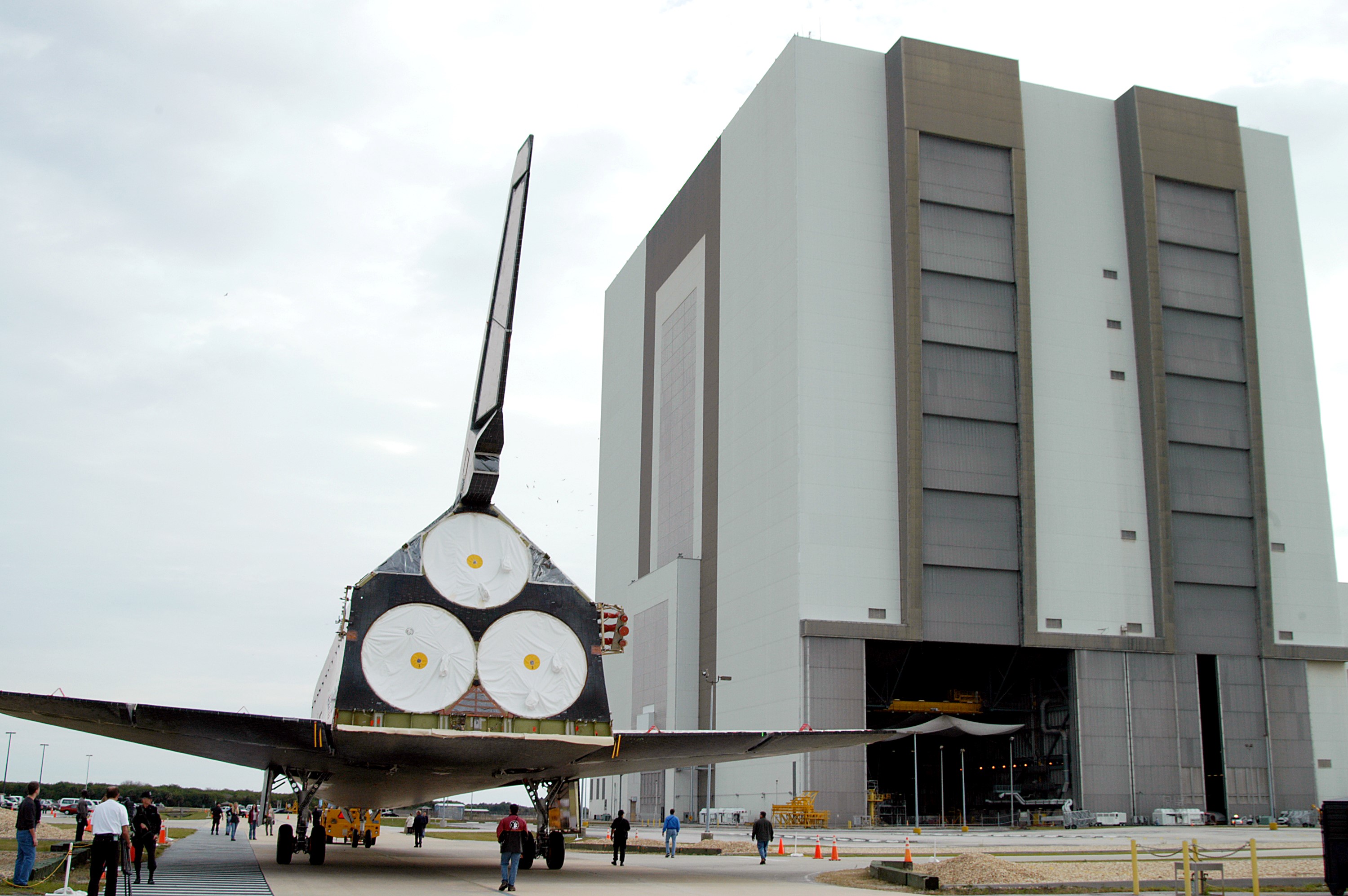 KENNEDY SPACE CENTER, FLA. -- Endeavour is towed toward the Vehicle Assembly Building for temporary storage. The orbiter has been moved from the Orbiter Processing Facility (OPF) to allow work to be performed in the OPF that can only be accomplished while the bay is empty. Work scheduled in the OPF includes annual validation of the bay’s cranes, work platforms, lifting mechanisms and jack stands. Endeavour will remain in the VAB for approximately 12 days, then return to the OPF.