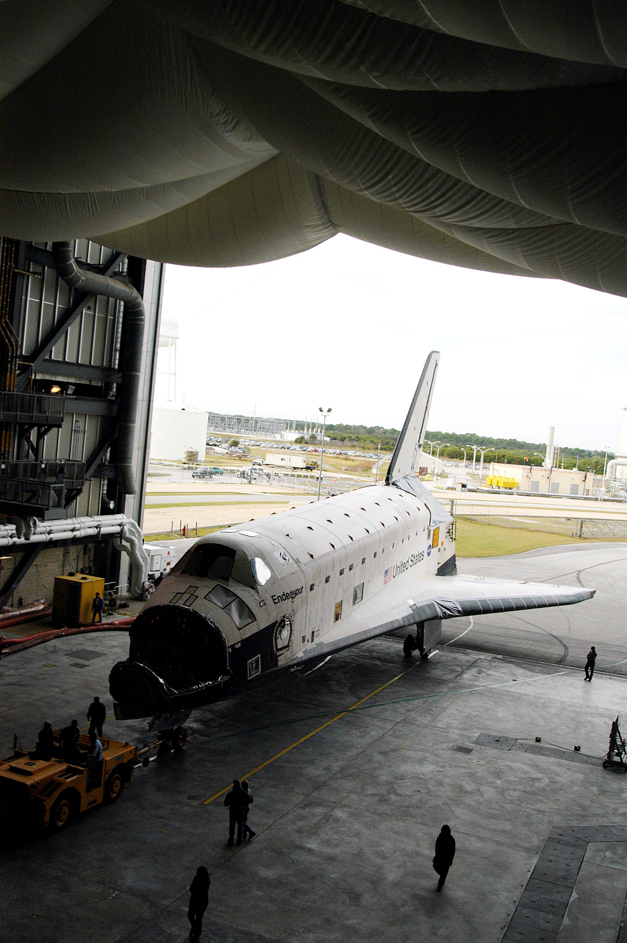 KENNEDY SPACE CENTER, FLA. -- Endeavour rolls into the Vehicle Assembly Building (VAB) for temporary storage. The orbiter has been moved from the Orbiter Processing Facility (OPF) to allow work to be performed in the OPF that can only be accomplished while the bay is empty. Work scheduled in the OPF includes annual validation of the bay’s cranes, work platforms, lifting mechanisms and jack stands. Endeavour will remain in the VAB for approximately 12 days, then return to the OPF.