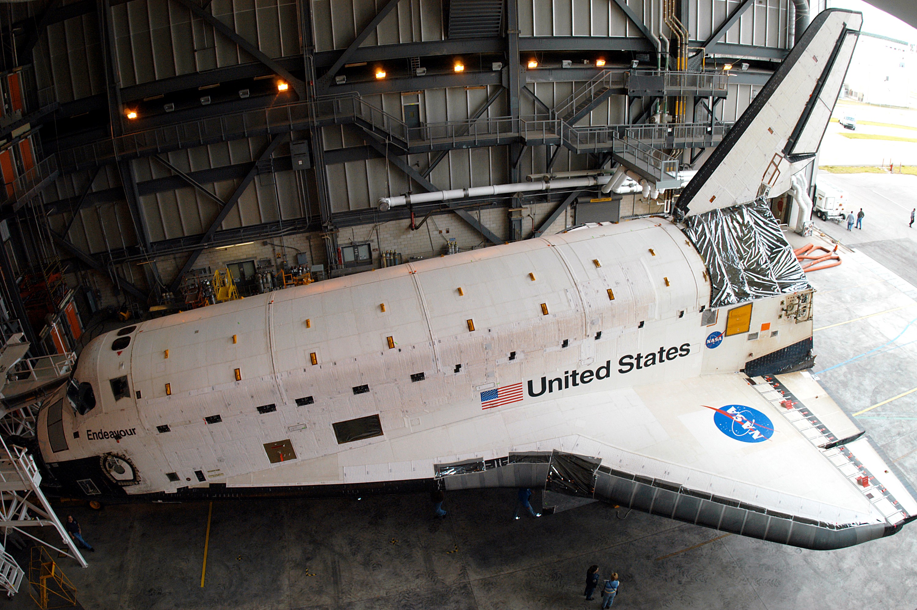 KENNEDY SPACE CENTER, FLA. -- Endeavour settles into place inside the Vehicle Assembly Building (VAB) where it has been moved for temporary storage. It left the Orbiter Processing Facility (OPF) to allow work to be performed in the OPF that can only be accomplished while the bay is empty. Work scheduled in the OPF includes annual validation of the bay’s cranes, work platforms, lifting mechanisms and jack stands. Endeavour will remain in the VAB for approximately 12 days, then return to the OPF.