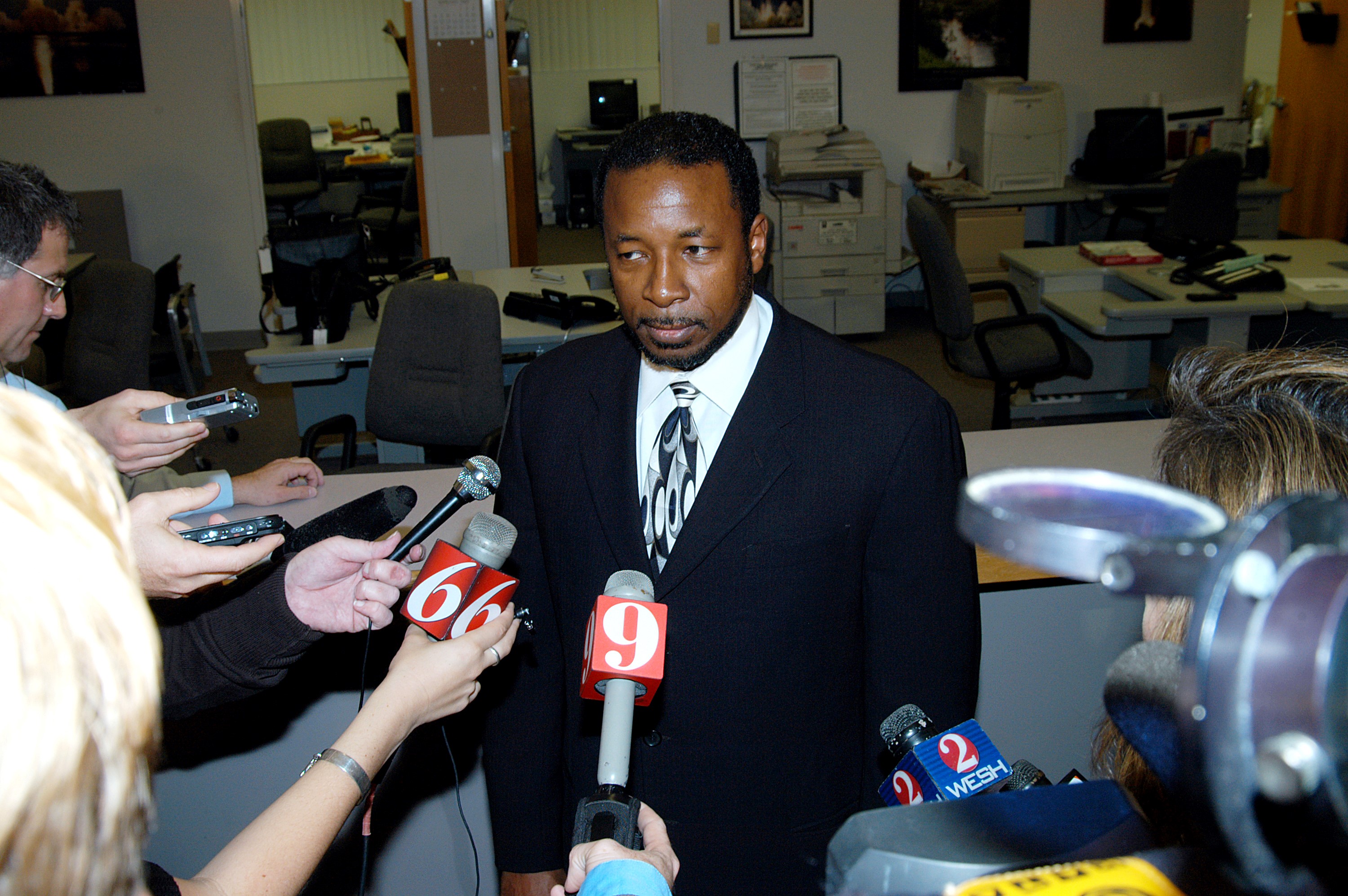 KENNEDY SPACE CENTER, FLA. -- Dr. Woodrow Whitlow, KSC deputy director, talks to the media at the NASA-KSC News Center after viewing President George W. Bush’s message on the future of NASA. The President stated his goals for NASA’s new mission: Completing the International Space Station, retiring the Space Shuttle orbiters, developing a new crew exploration vehicle, and returning to the moon and beyond within the next two decades. Pres. Bush was welcomed by NASA Administrator Sean O’Keefe and Expedition 8 Commander Michael Foale, who greeted him from the International Space Station.