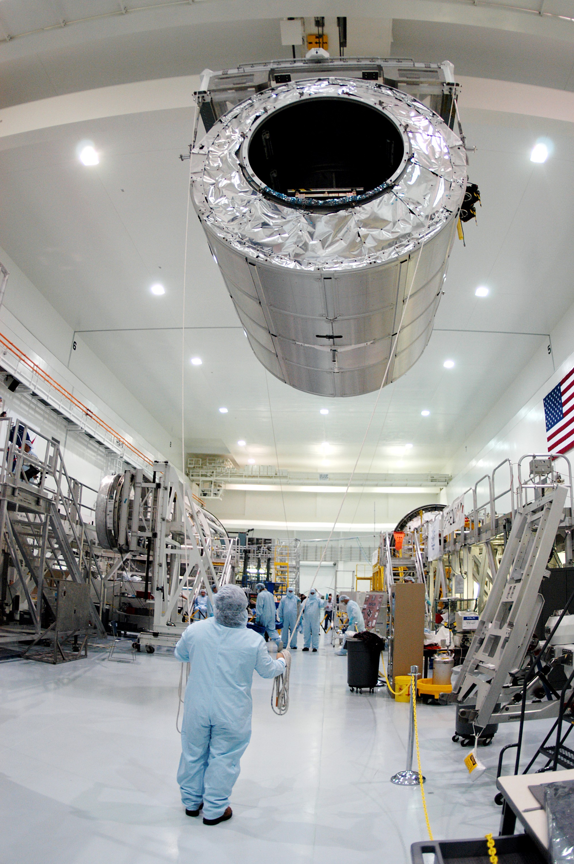 KENNEDY SPACE CENTER, FLA. - In the Space Station Processing Facility, the Multi-Purpose Logistics Module Raffaello glides above the floor as it moves to another stand on the other side. Raffaello is the second MPLM built by the Italian Space Agency, serving as a reusable logistics carrier and primary delivery system to resupply and return station cargo requiring a pressurized environment. It is being moved to allow the third MPLM, Donatello, to be brought in for routine testing. Donatello has been stored in the Operations and Checkout Building. This is the first time all three MPLMs are in the SSPF; the other one is the Leonardo. Raffaello is scheduled to fly on Space Shuttle Atlantis on mission STS-114.