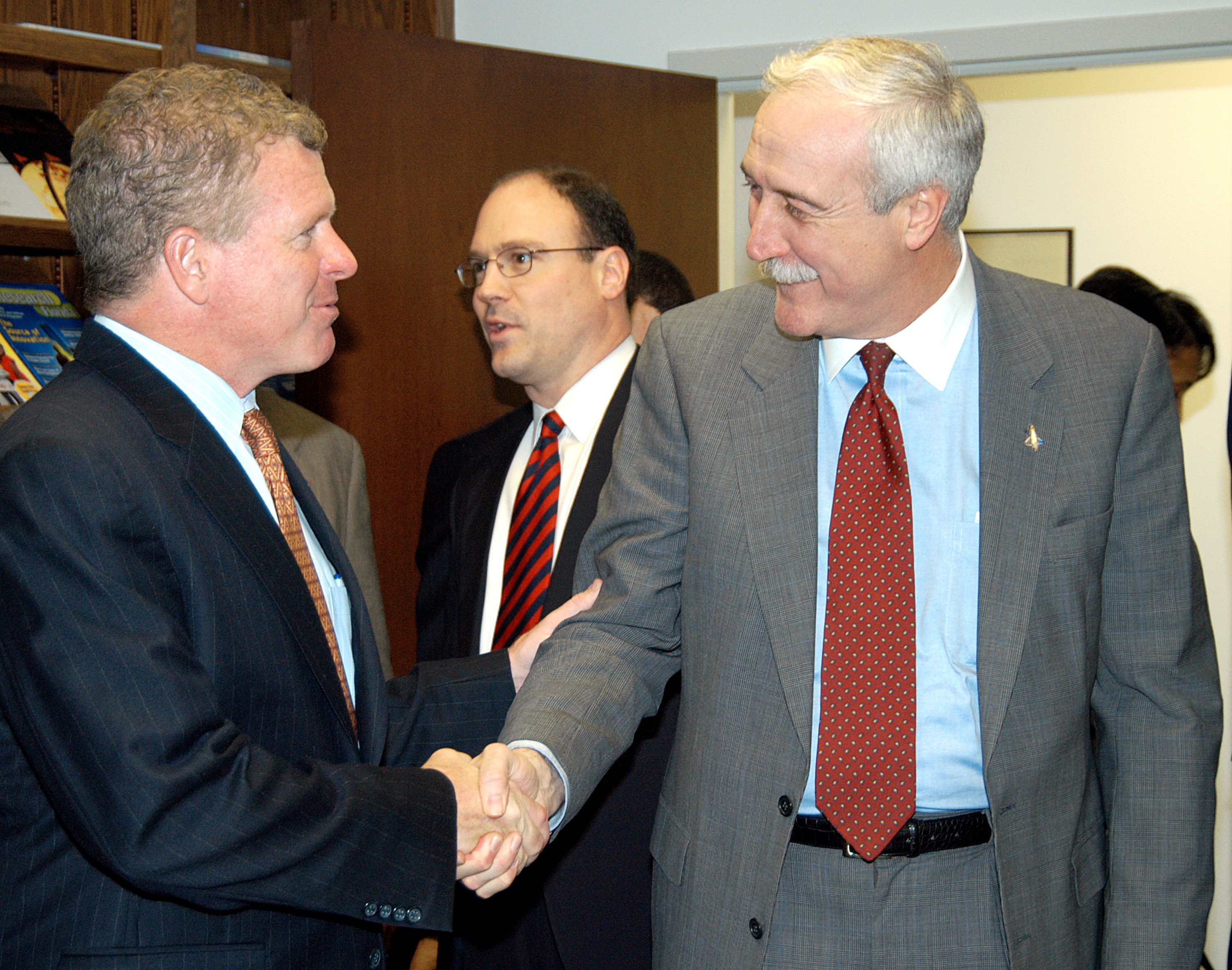KENNEDY SPACE CENTER, FLA. - NASA Administrator Sean O’Keefe (right) greets Florida Congressman Tom Feeney during a tour of the Central Florida Research Park, near Orlando. Central Florida leaders are proposing the research park as the site for the new NASA Shared Services Center. The center would centralize NASA’s payroll, accounting, human resources, facilities and procurement offices that are now handled at each field center. The consolidation is part of the One NASA focus. Six sites around the U.S. are under consideration by NASA.