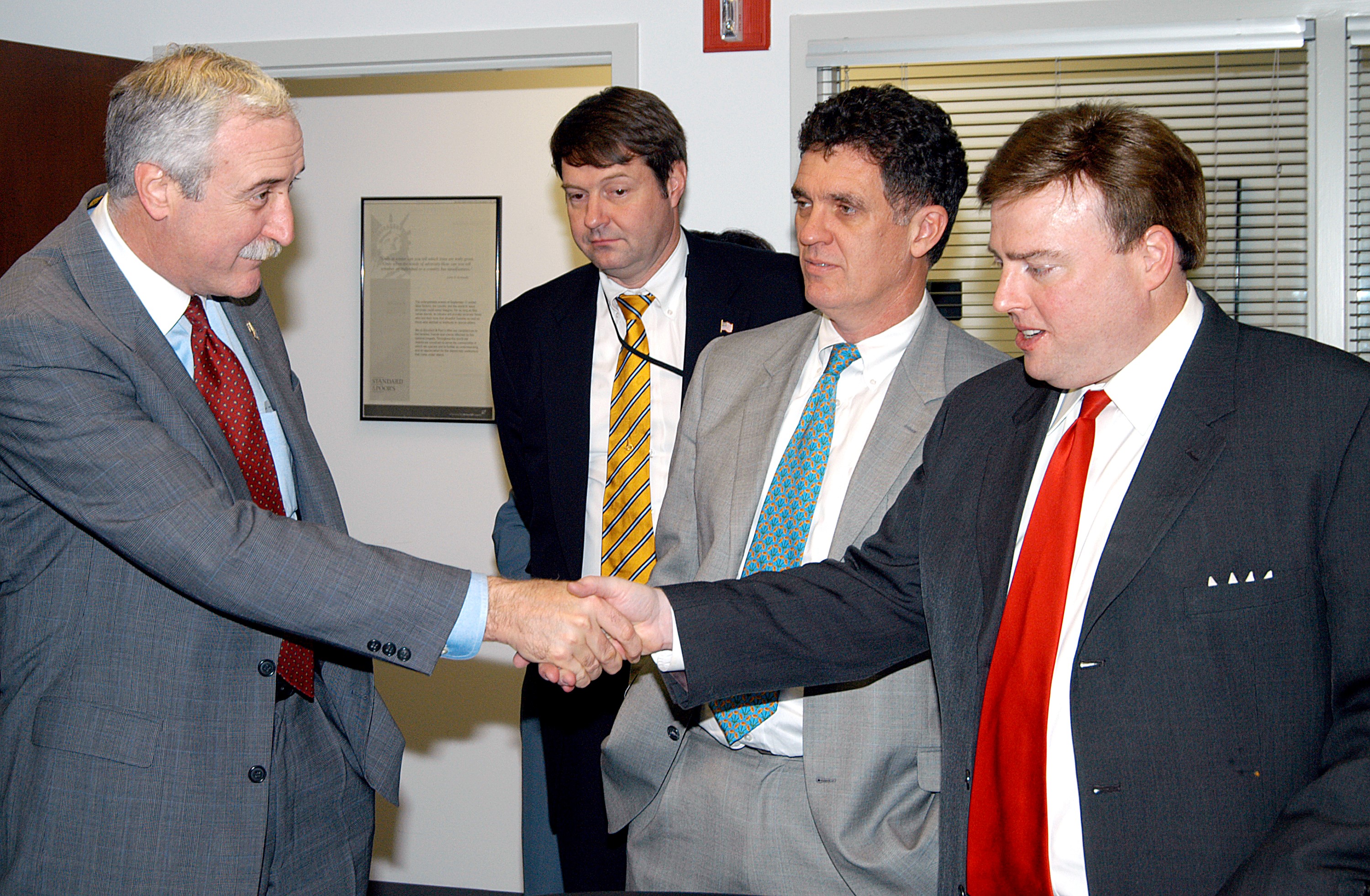 KENNEDY SPACE CENTER, FLA. - NASA Administrator Sean O’Keefe (left) greets U.S. Representative Ric Keller during a tour of the Central Florida Research Park, near Orlando. Central Florida leaders are proposing the research park as the site for the new NASA Shared Services Center. The center would centralize NASA’s payroll, accounting, human resources, facilities and procurement offices that are now handled at each field center. The consolidation is part of the One NASA focus. Six sites around the U.S. are under consideration by NASA.