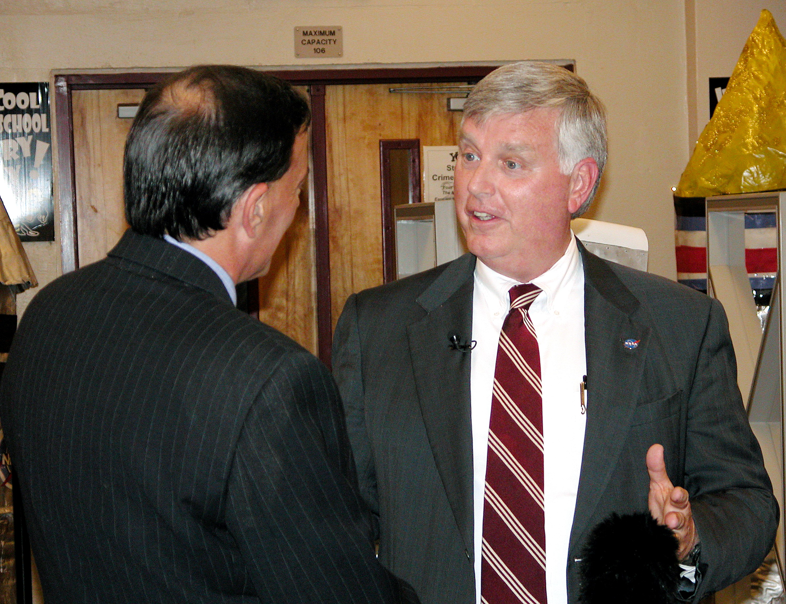 KENNEDY SPACE CENTER, FLA. - Warren Elly (left), with WTVT-TV, Fox News, talks with Center Director Jim Kennedy at Garland V. Stewart Magnet Middle School, a NASA Explorer School (NES) in Tampa, Fla. Kennedy was joined by astronaut Kay Hire in sharing the agency’s new vision for space exploration with the next generation of explorers. Kennedy talked with students about our destiny as explorers, NASA’s stepping stone approach to exploring Earth, the Moon, Mars and beyond, how space impacts our lives, and how people and machines rely on each other in space.
