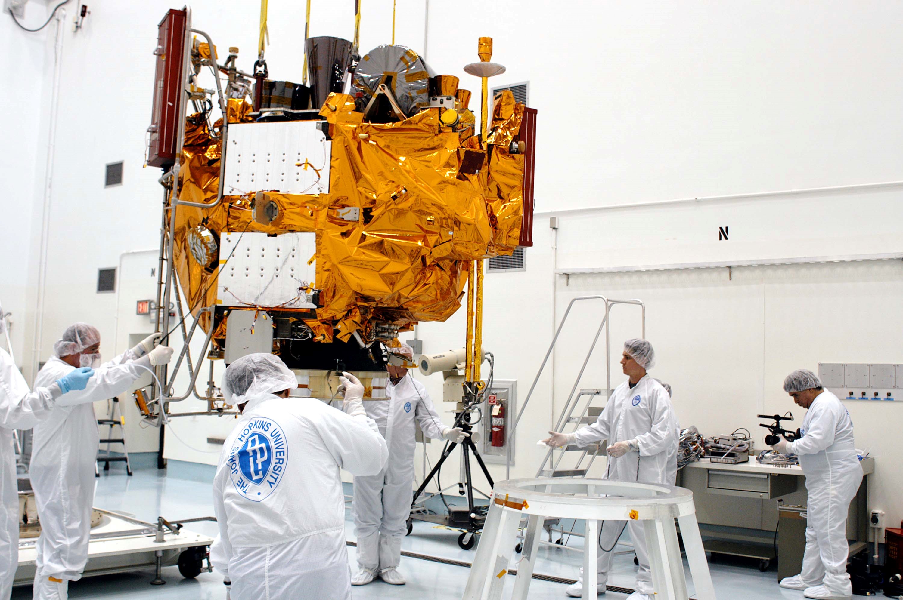 KENNEDY SPACE CENTER, FLA. - At the Astrotech Space Operations processing facilities, an overhead crane lowers NASA’s MESSENGER spacecraft onto a work stand. There employees of the Johns Hopkins University Applied Physics Laboratory, builders of the spacecraft, will perform an initial state-of-health check. Then processing for launch can begin, including checkout of the power systems, communications systems and control systems. The thermal blankets will also be attached for flight. MESSENGER - short for MErcury Surface, Space ENvironment, GEochemistry and Ranging - will be launched May 11 on a six-year mission aboard a Boeing Delta II rocket. Liftoff is targeted for 2:26 a.m. EDT on Tuesday, May 11.