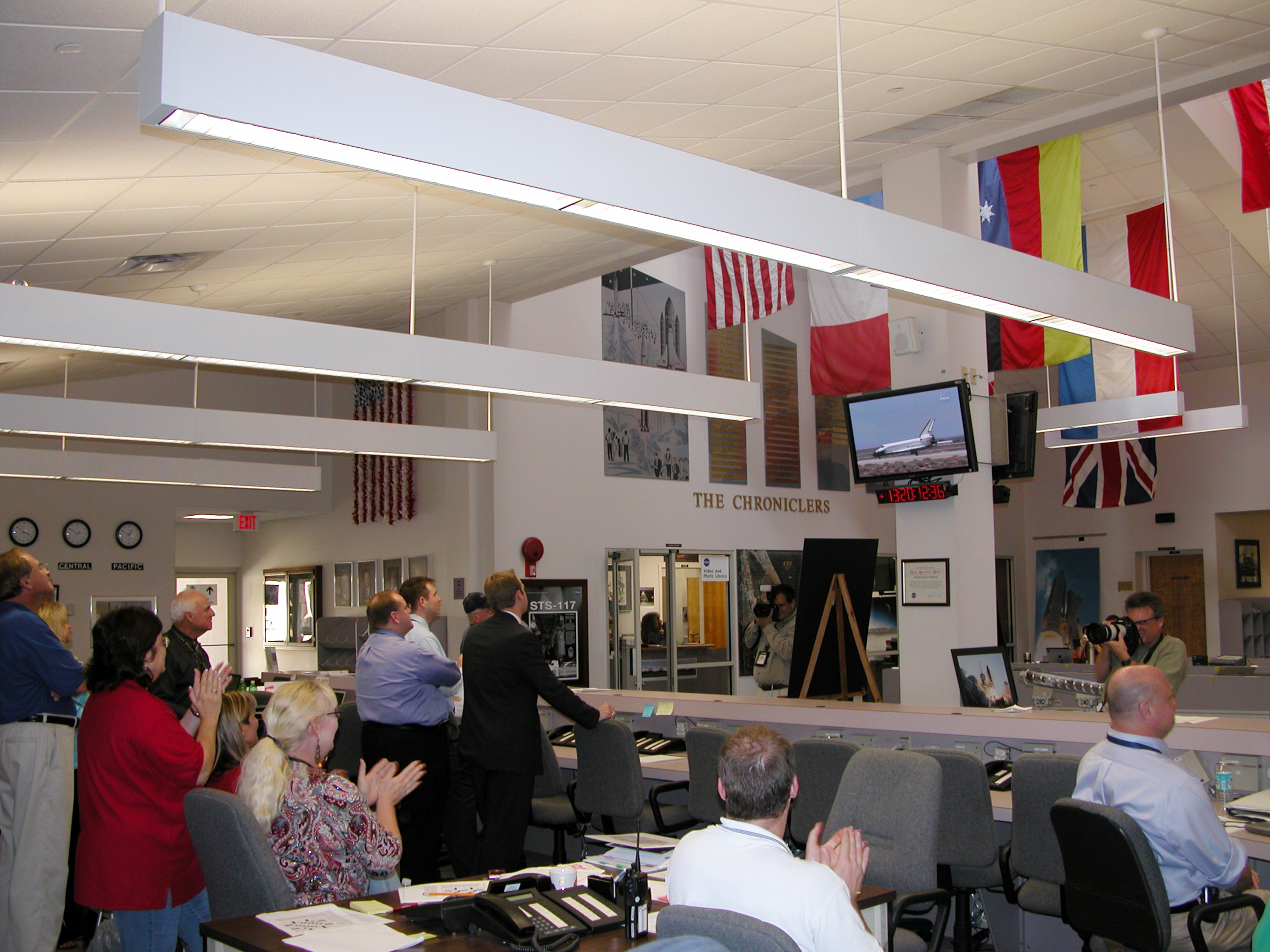 Media and staff in the NASA News Center at Kennedy Space Center