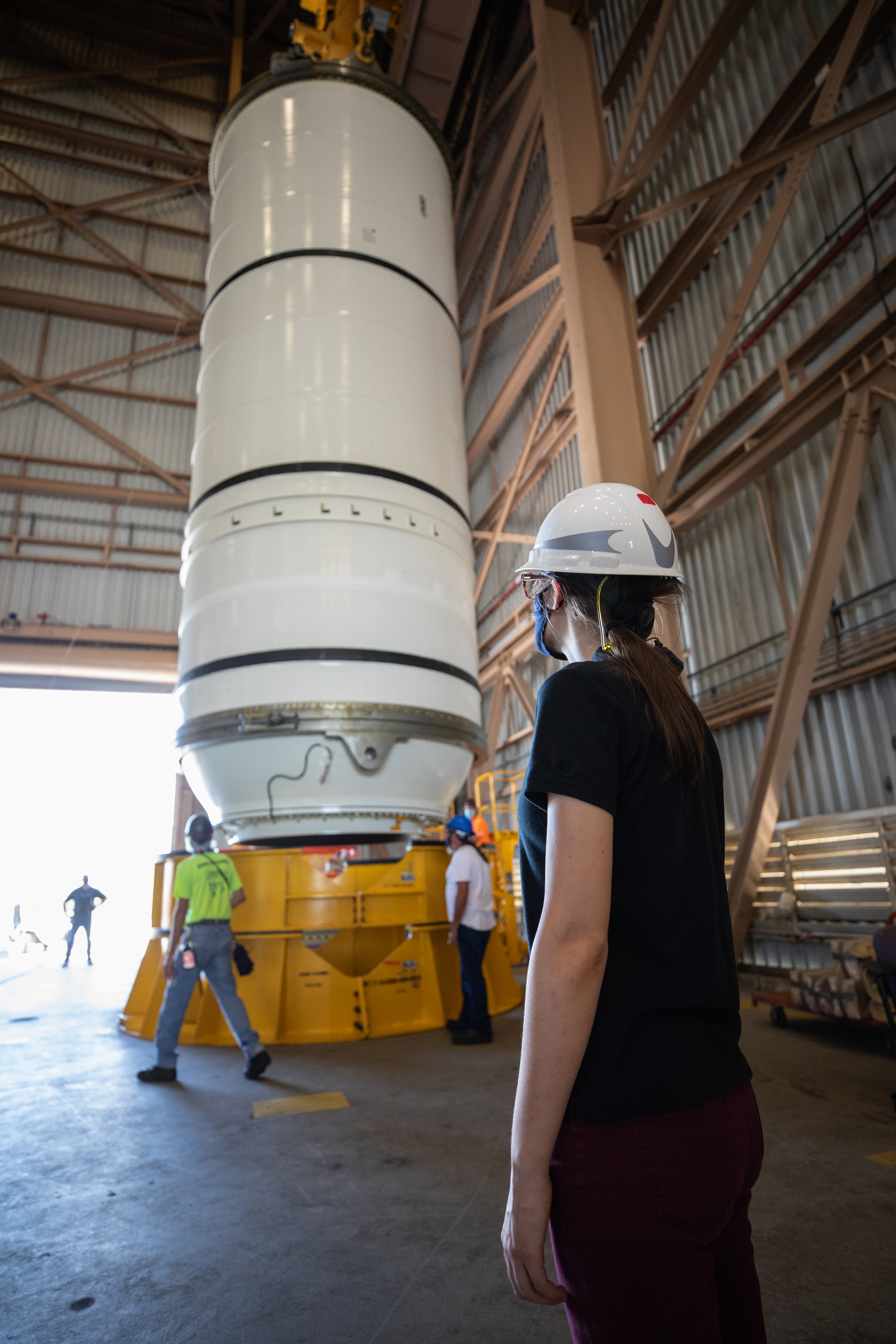 Artemis I Booster Segments Lift to Work Stand and Silhouettes