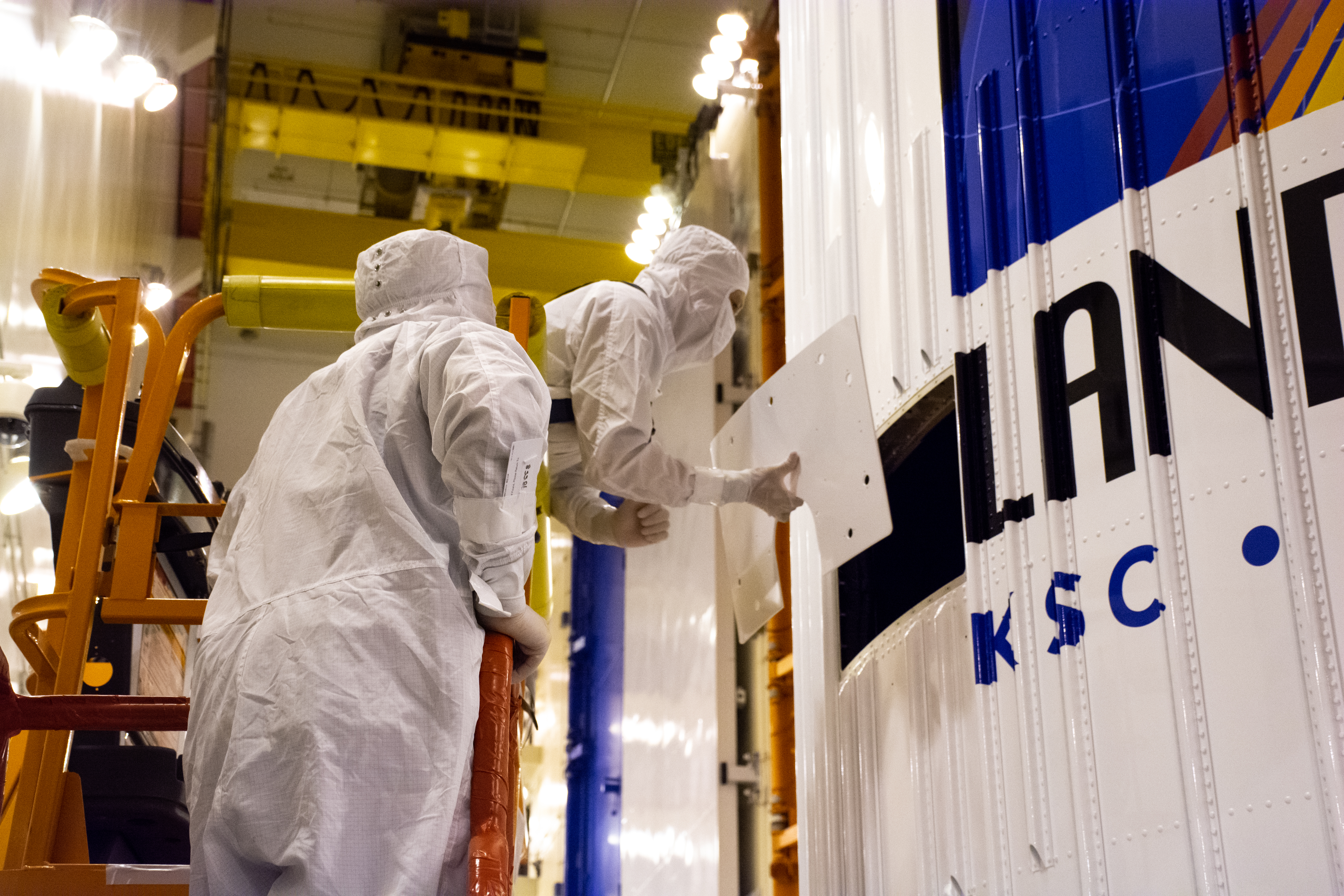 Landsat 9 Fairing Contamination Barrier and Access Door Removal