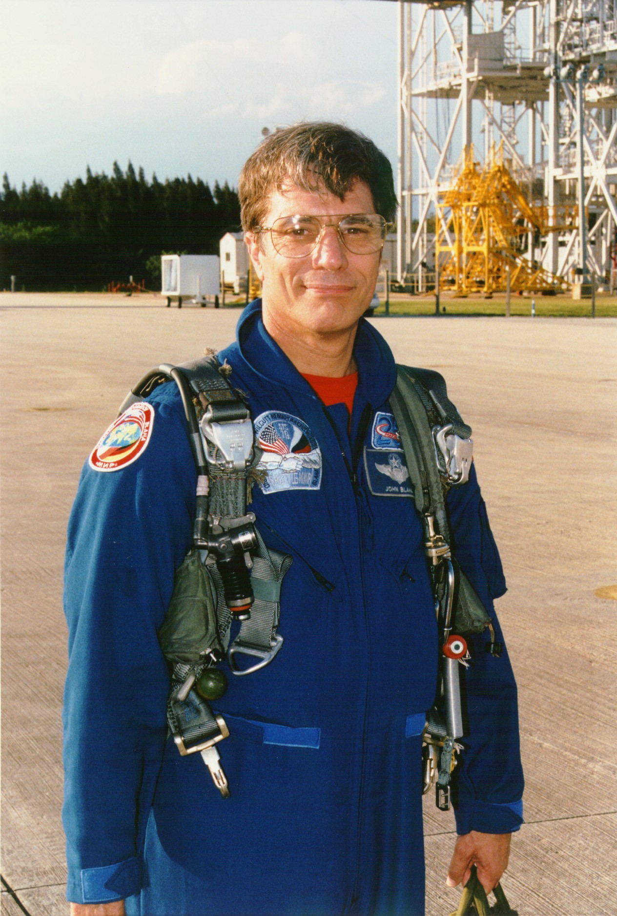 KENNEDY SPACE CENTER, FLA. - STS-79 Mission Specialist John E. Blaha arrives at KSC's Shuttle Landing Facility with five fellow astronauts, ready to participate in the Terminal Countdown Demonstration Test (TCDT). The TCDT is a dress rehearsal for launch for the flight crew and launch team. Over the next several days, the astronauts will take part in training exercises at the launch pad that will culminate in a simulated launch countdown. The Space Shuttle Atlantis is being prepared for liftoff around Sept. 12 on STS-79, the fourth docking between the U.S. Shuttle and Russian Space Station Mir. During the approximately nine-day flight, Blaha will change places with fellow spaceflight veteran Shannon Lucid, who is wrapping up a record-setting stay on Mir. Blaha will remain aboard the Station for about four months, returning to Earth in January 1997 withthe crew of Shuttle Mission STS-81.