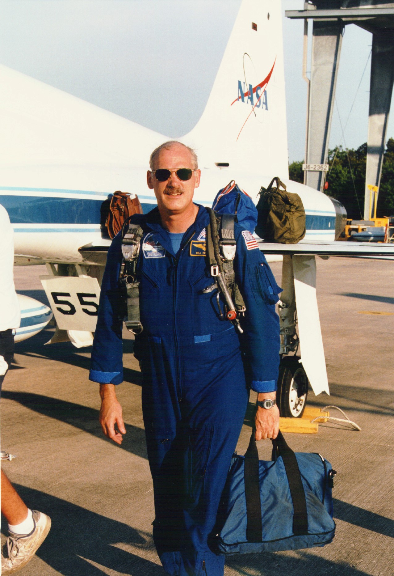 KENNEDY SPACE CENTER, FLA. - STS-79 Commander William F. Readdy arrives at KSC's Shuttle Landing Facility with five fellow astronauts, ready to participate in the Terminal Countdown Demonstration Test (TCDT). The TCDT is a dress rehearsal for launch for the flight crew and launch team. Over the next several days, the astronauts will take part in training exercises at the launch pad that will culminate in a simulated launch countdown. The Space Shuttle Atlantis is being prepared for liftoff on STS-79 around Sept. 12.