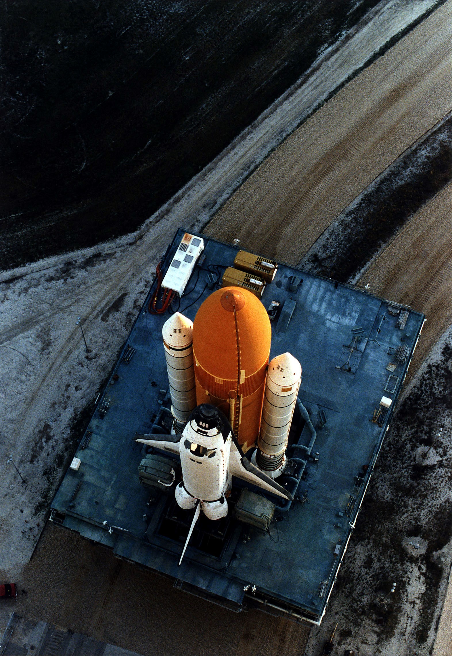 KENNEDY SPACE CENTER, FLA. - The Space Shuttle Discovery on its Mobile Launcher Platform slowly moves through the high bay doors of the Vehicle Assembly Building en route to Launch Pad 39A, where Discovery is scheduled to lift off on the STS-82 mission on Feb. 11. A seven-member crew will perform the second servicing of the orbiting Hubble Space Telescope (HST) during the 10-day STS-82 mission.