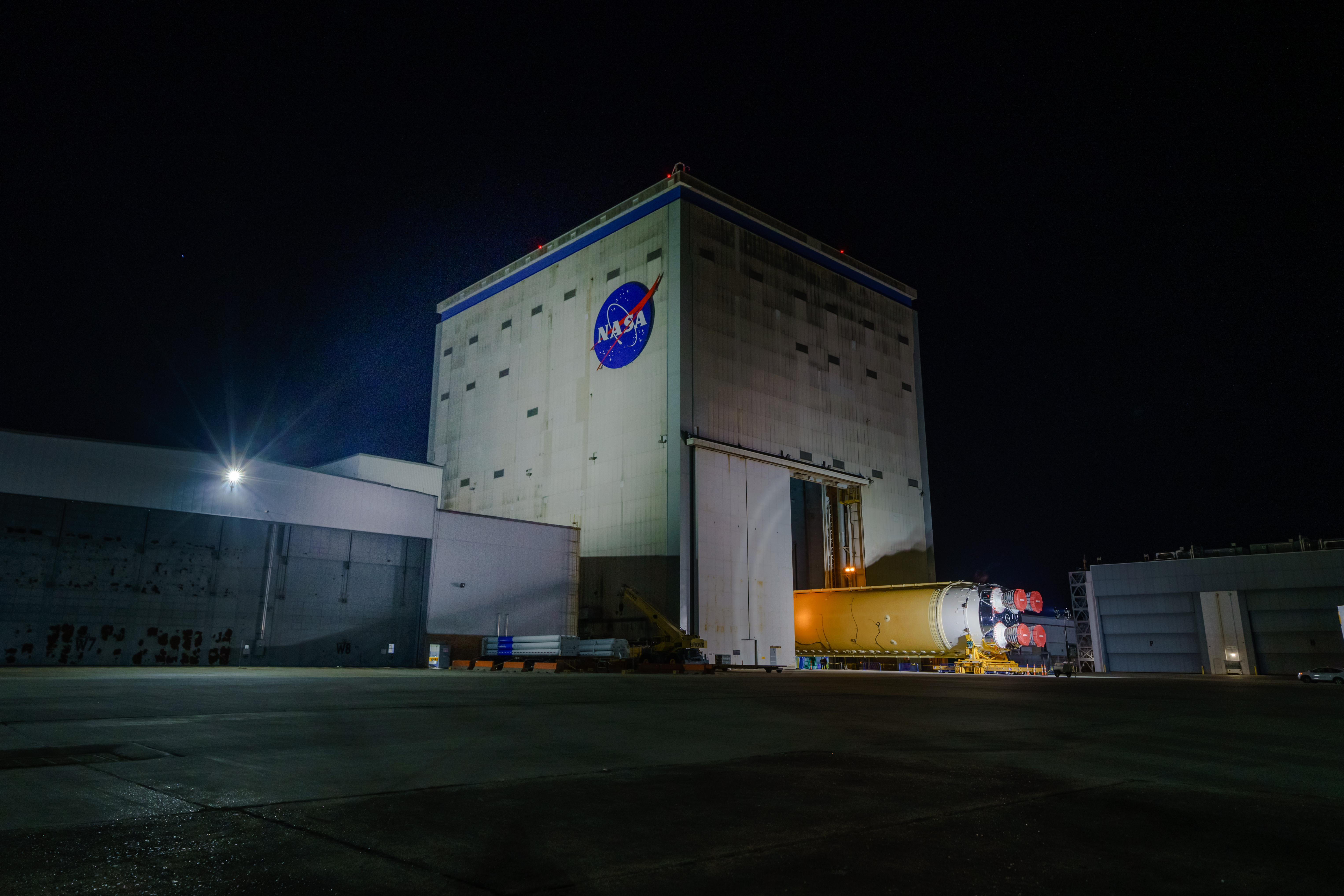 NASA Moves First Artemis SLS Rocket Stage from NASA’s Factory to Barge
