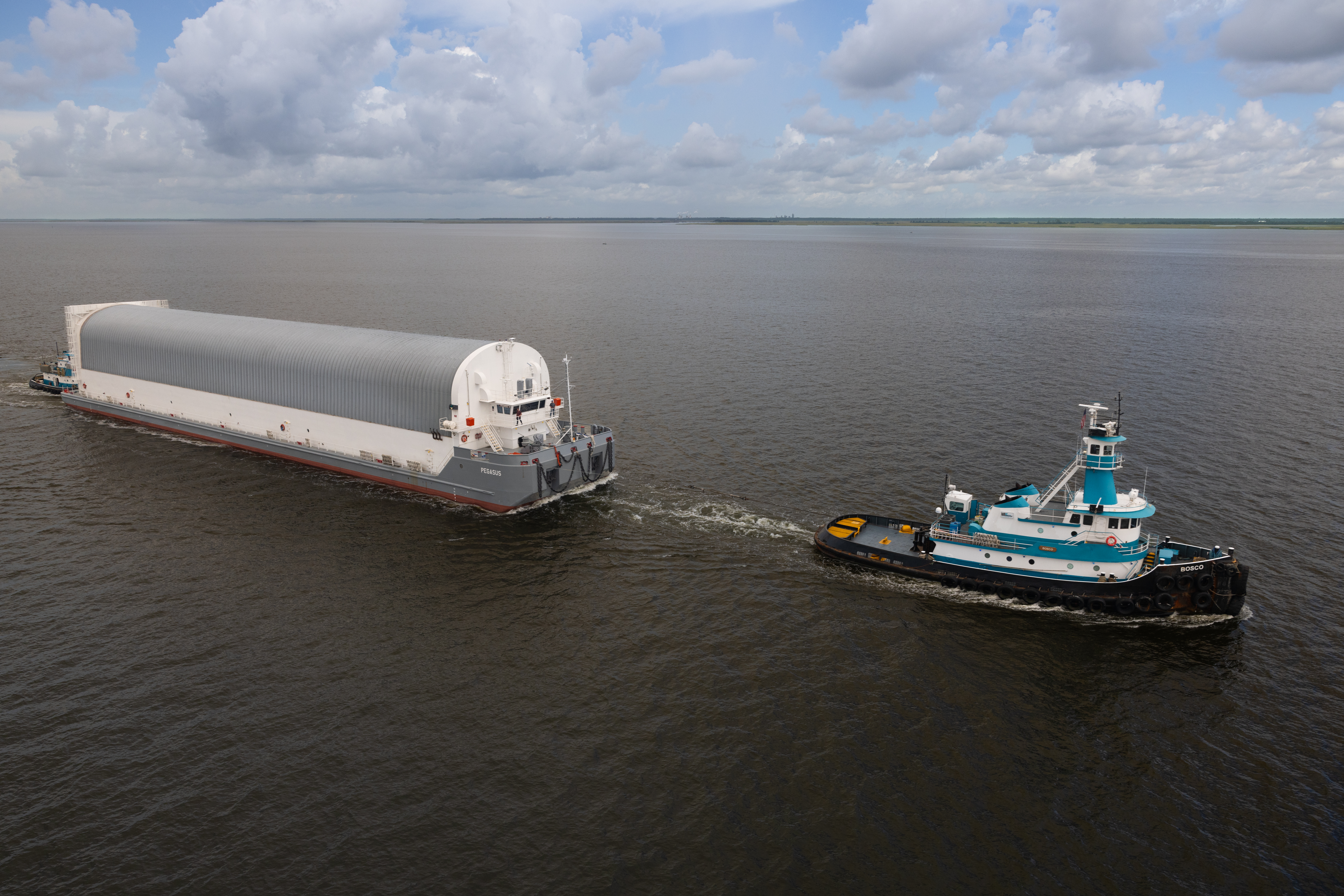 NASA Photographers Capture Aerial Views of Pegasus Barge with Artemis II Rocket Stage