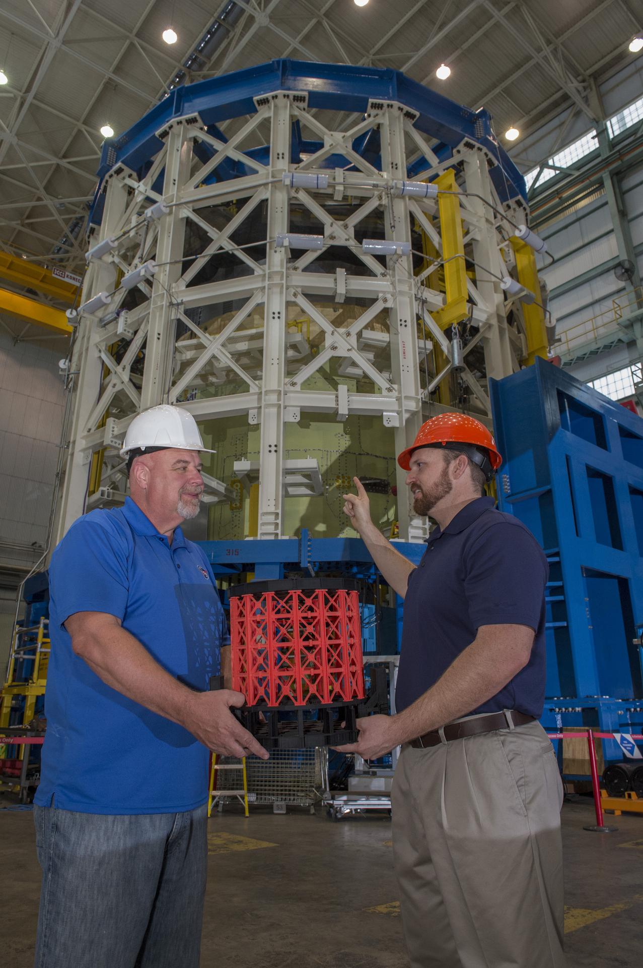 John Honeycutt and Mark White with SLS test stand and model