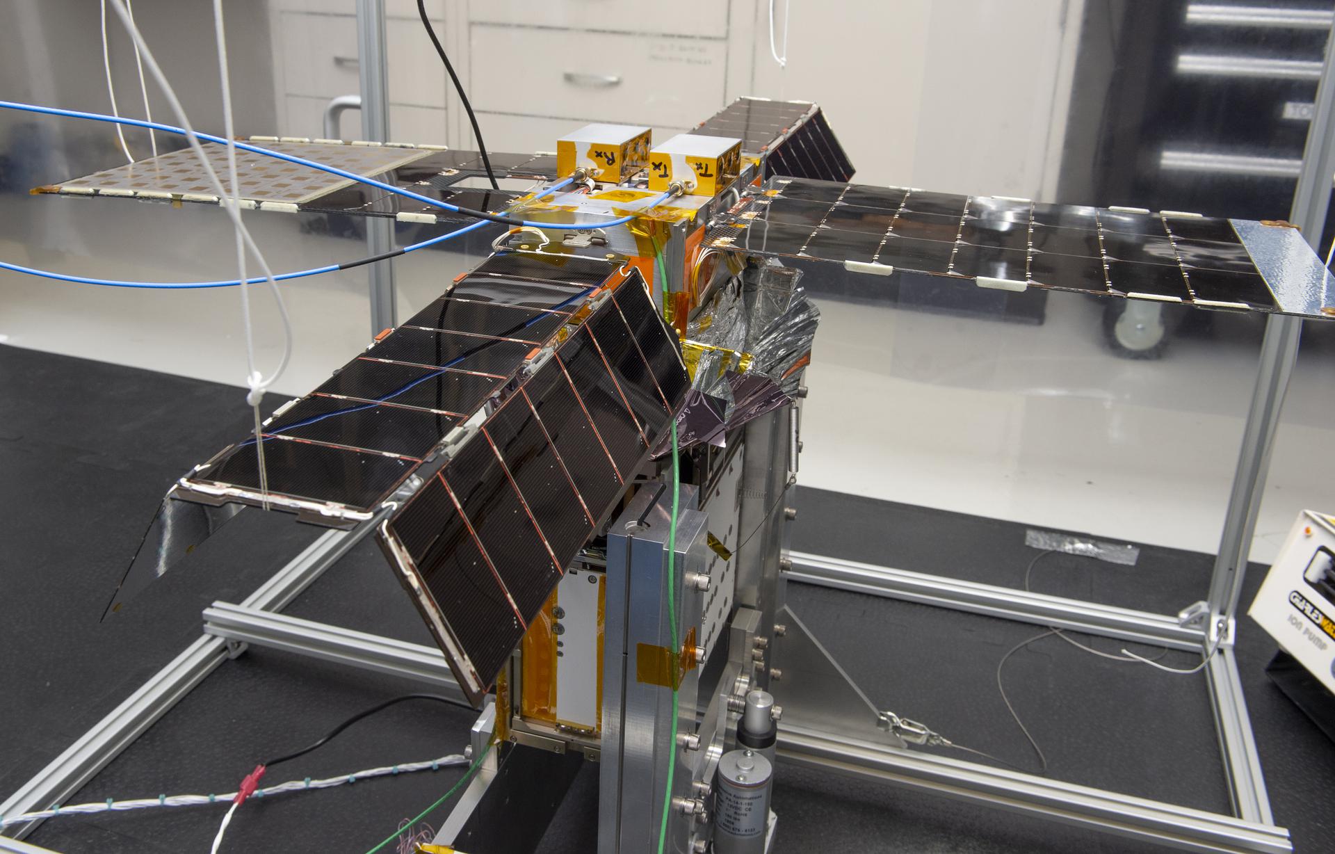 Spacecraft in Gravity Off-load Fixture (GOLF), System Test configuration - Arisa Waddle – Test Engineer, Rick Wilson – Lead Test Engineer