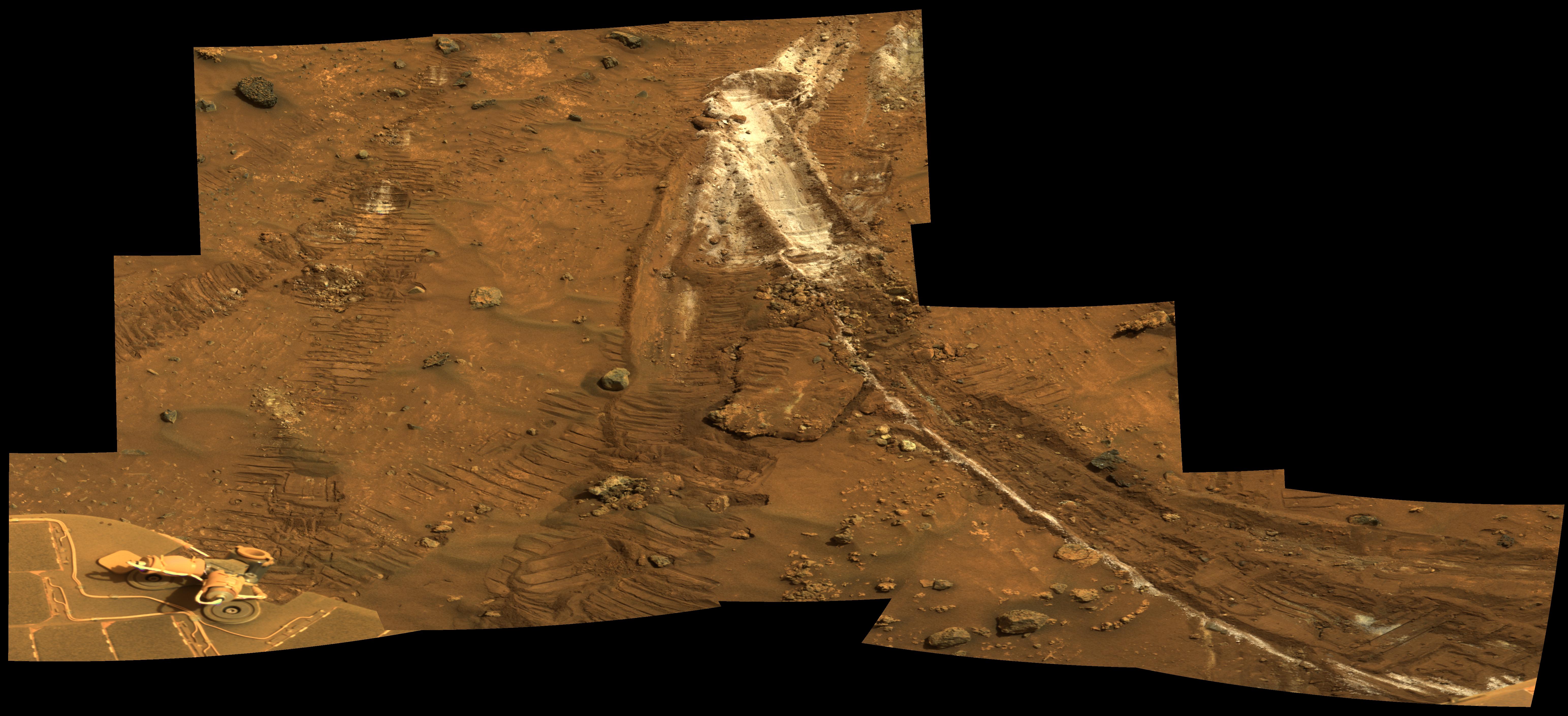 Rover Wheel Churns Up Bright Martian Soil