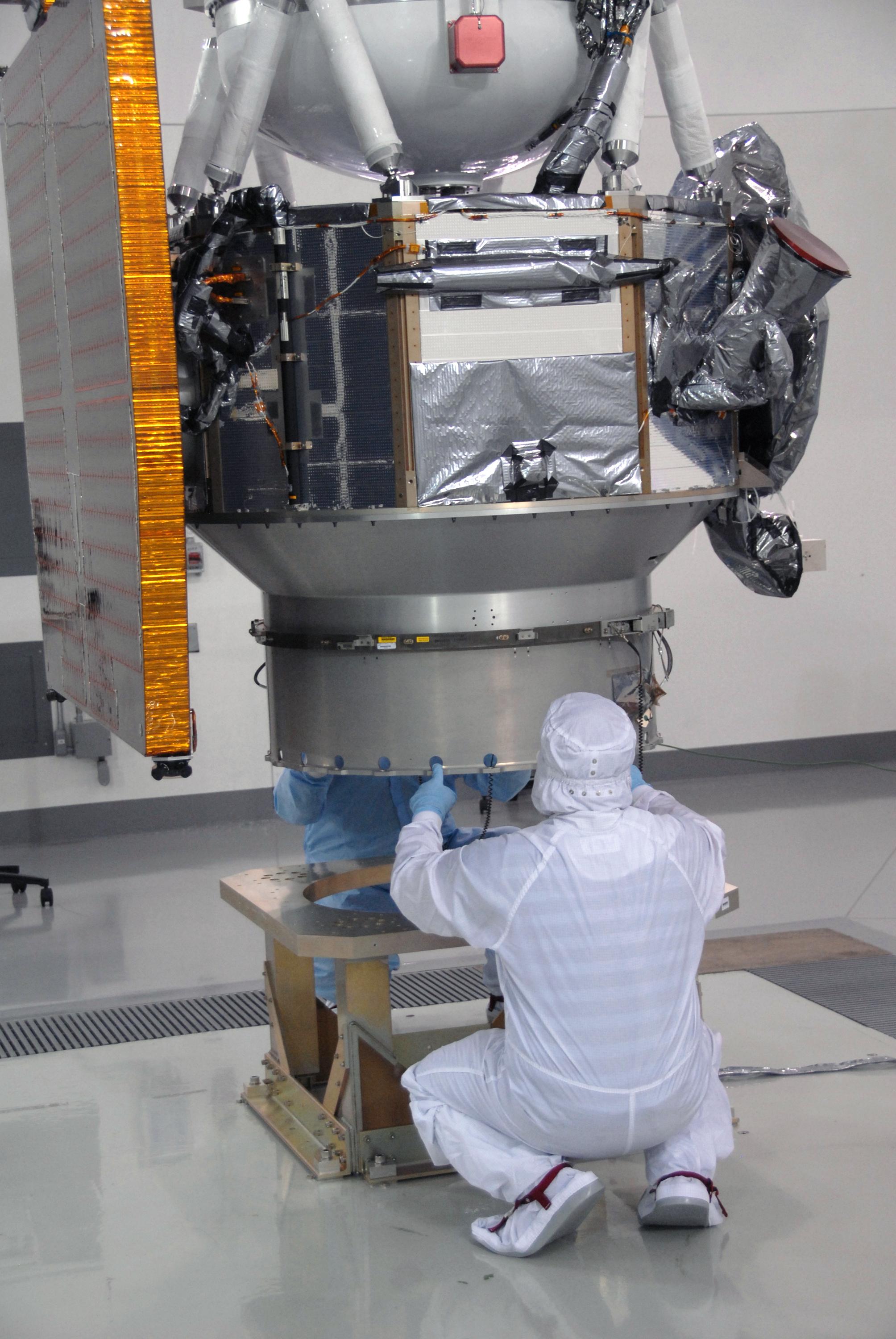 NASA WISE Spacecraft Lowered onto Work Stand