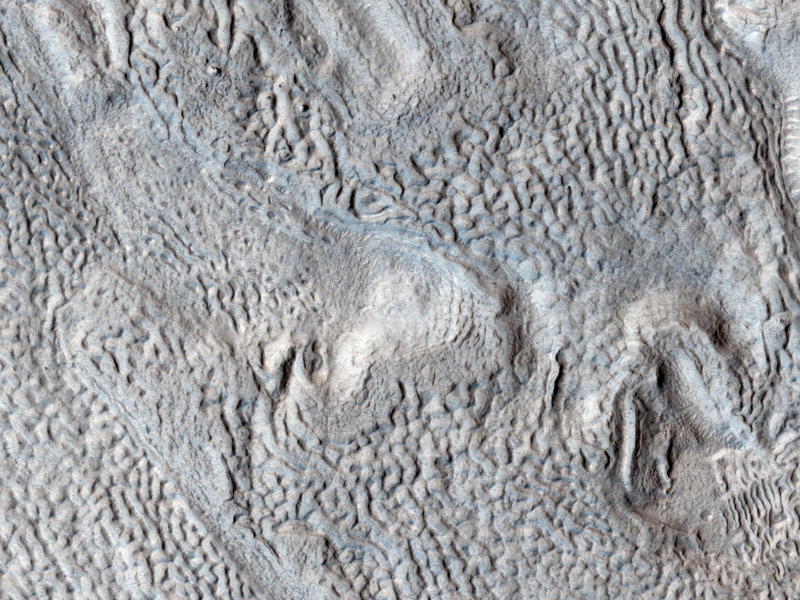 Ridges and Grooves That Wave and Buckle on a Valley Floor