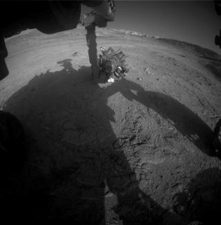 Curiosity Works Its Robotic Arm During Sunset