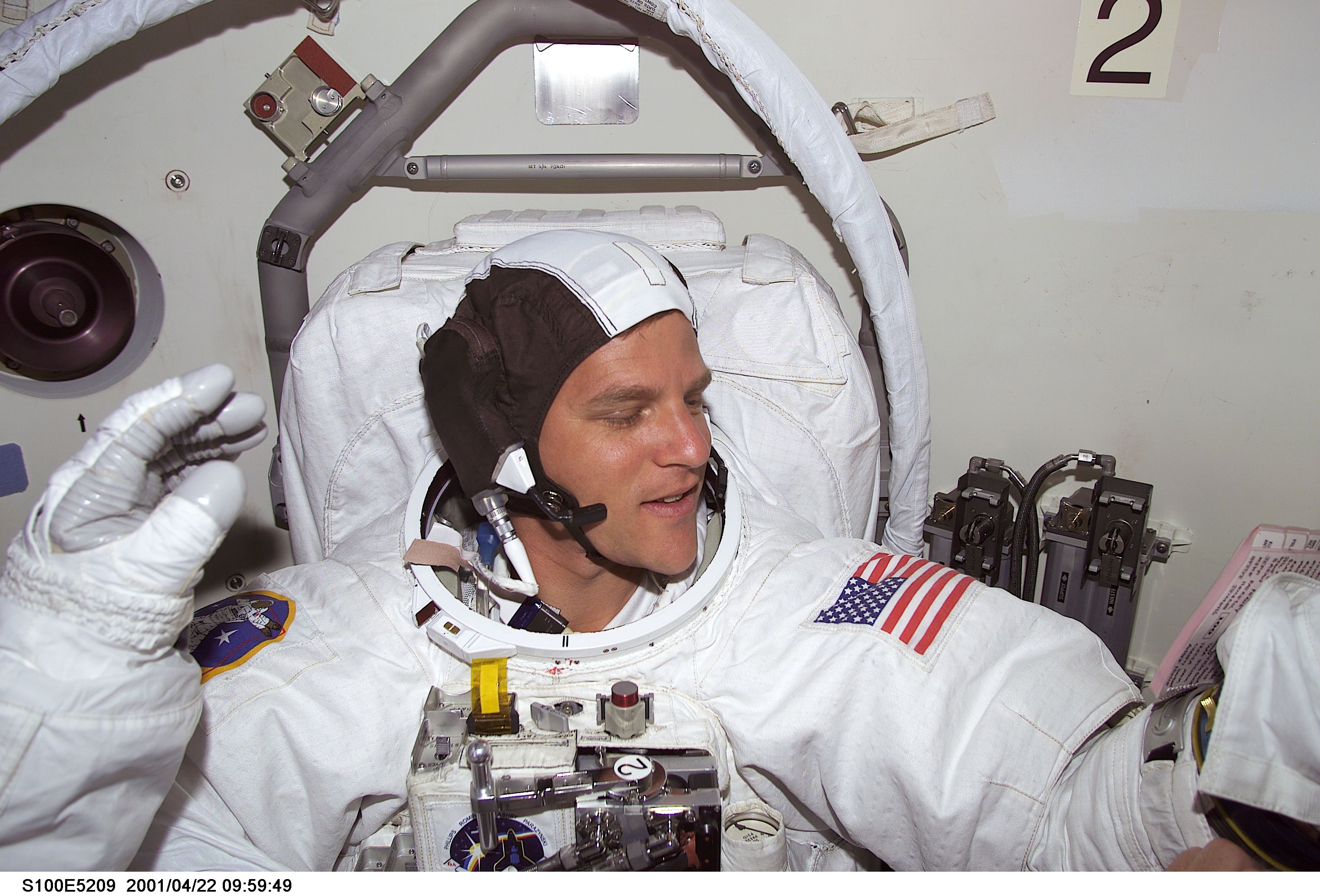 MS Parazynski prepares for the first EVA of STS-100 in the airlock of Endeavour