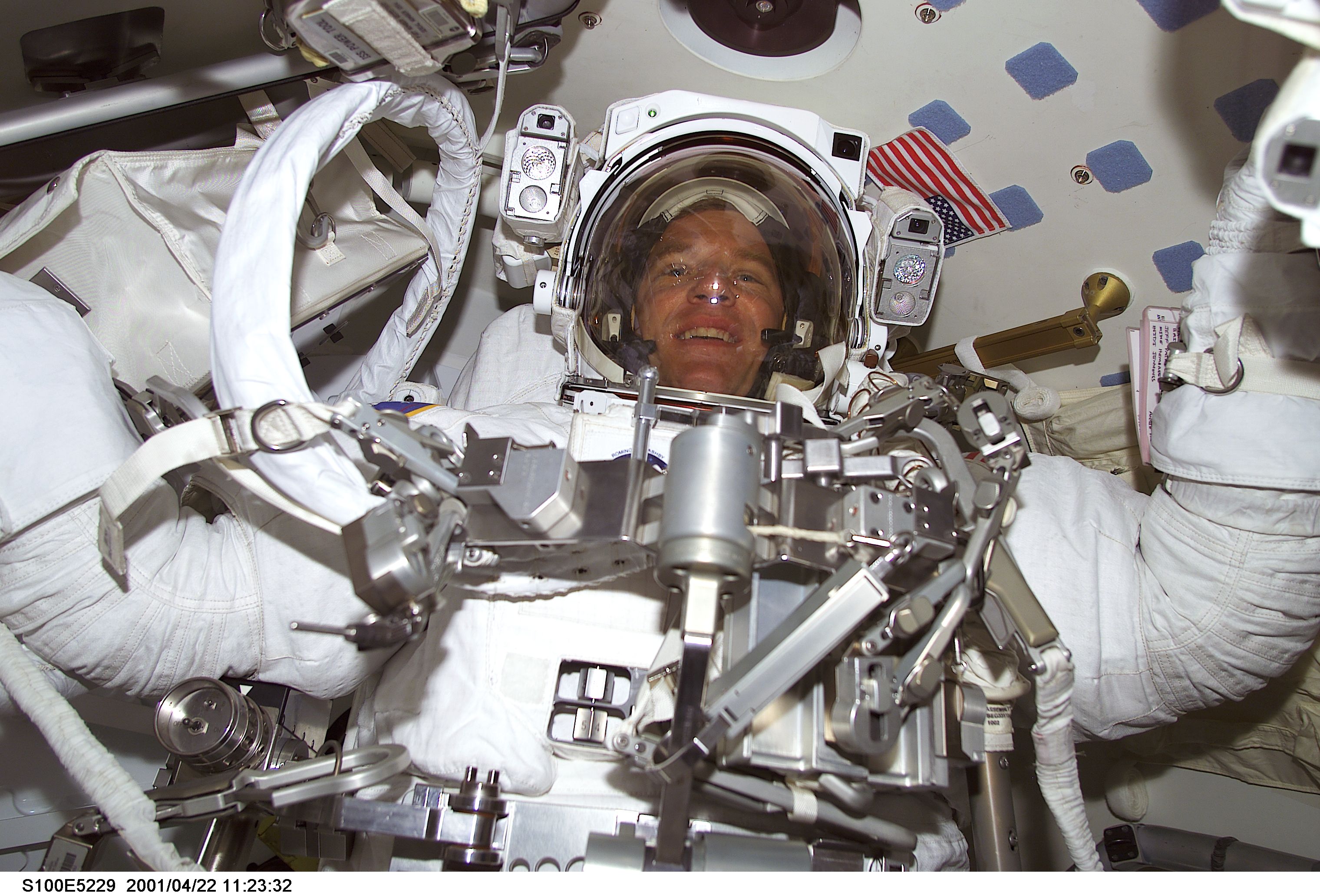 MS Parazynski stands ready for the first EVA of STS-100 in the airlock of Endeavour
