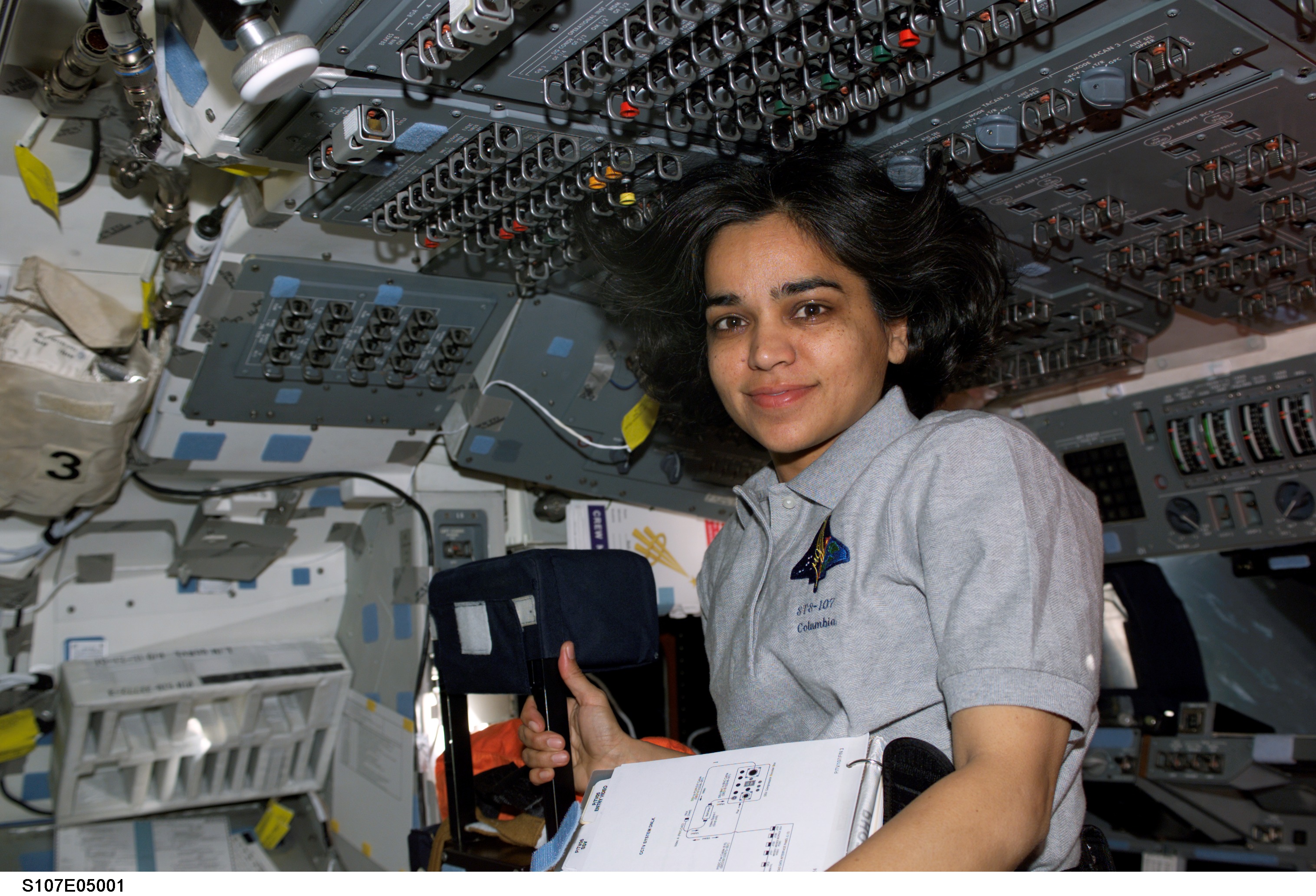 Chawla smiles from the AFD of Columbia during STS-107